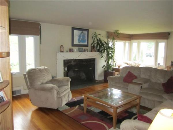 7 Zenith Drive Worcester, MA 01602 - Photo 9 of 13 a living room with furniture a large window and a fireplace