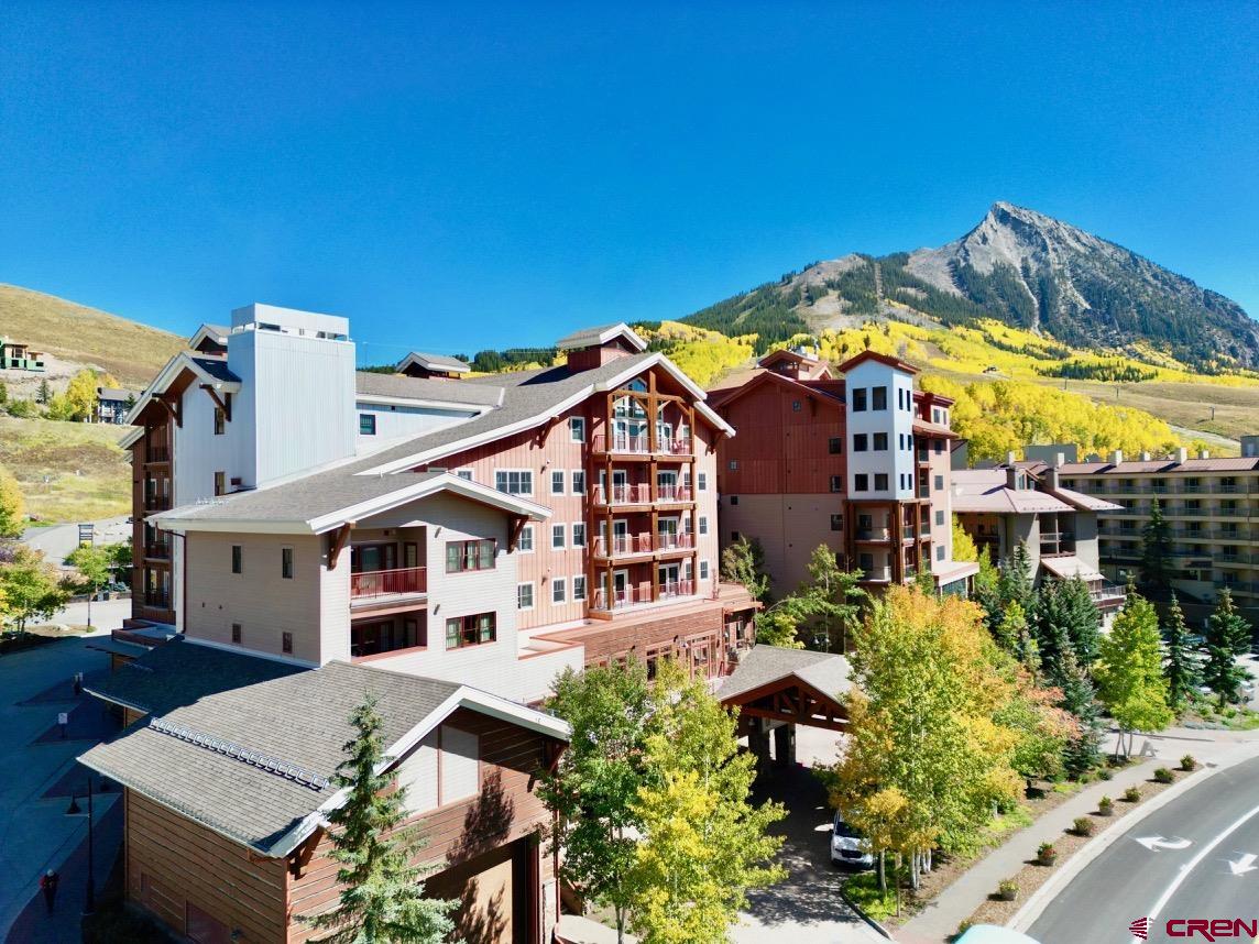 620 Gothic Road, Unit 206 Crested Butte, CO 81225 - Photo 1 of 41 a view of a house with pool and sitting area