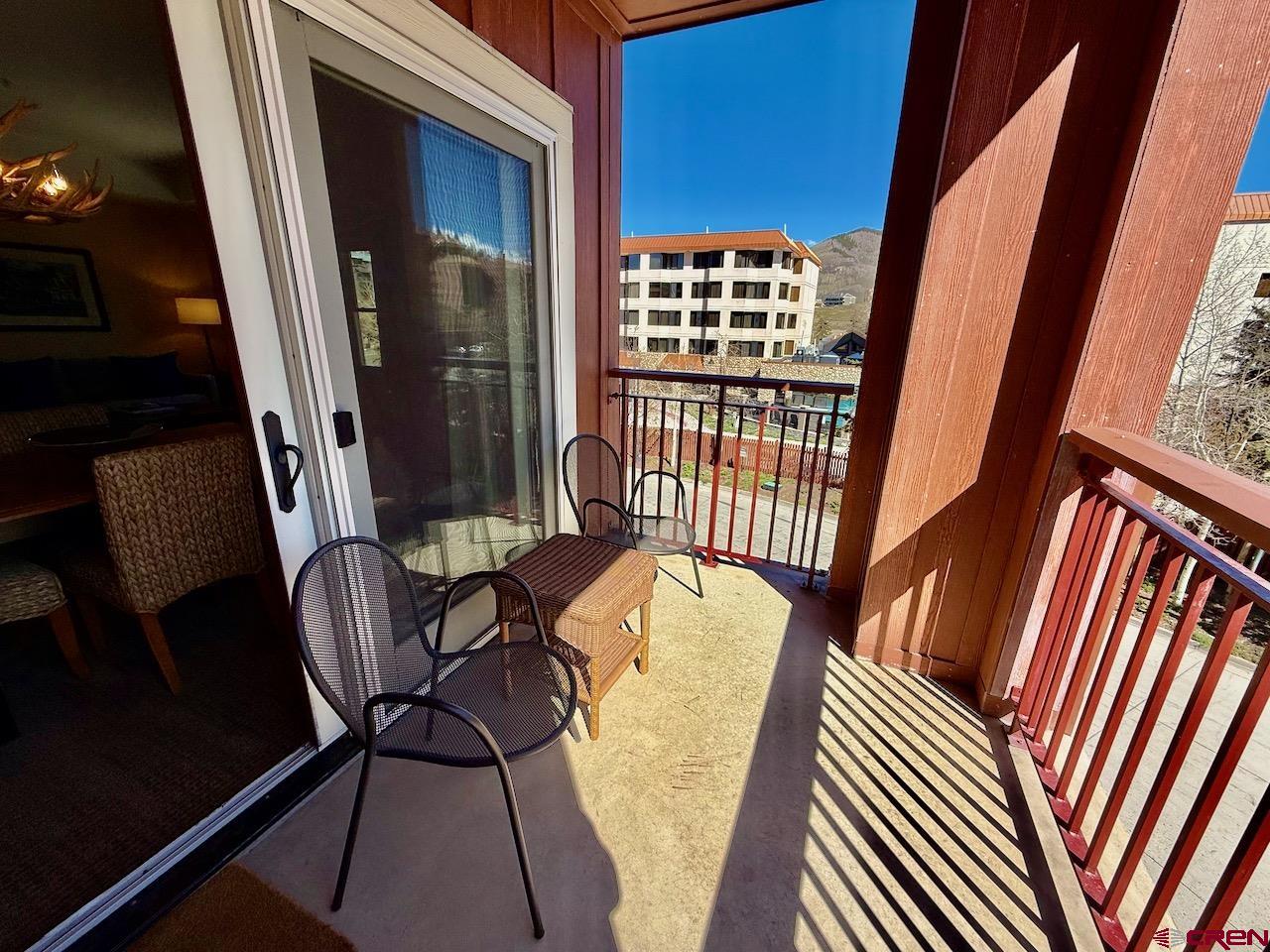 620 Gothic Road, Unit 206 Crested Butte, CO 81225 - Photo 29 of 41 a view of balcony with furniture and wooden floor