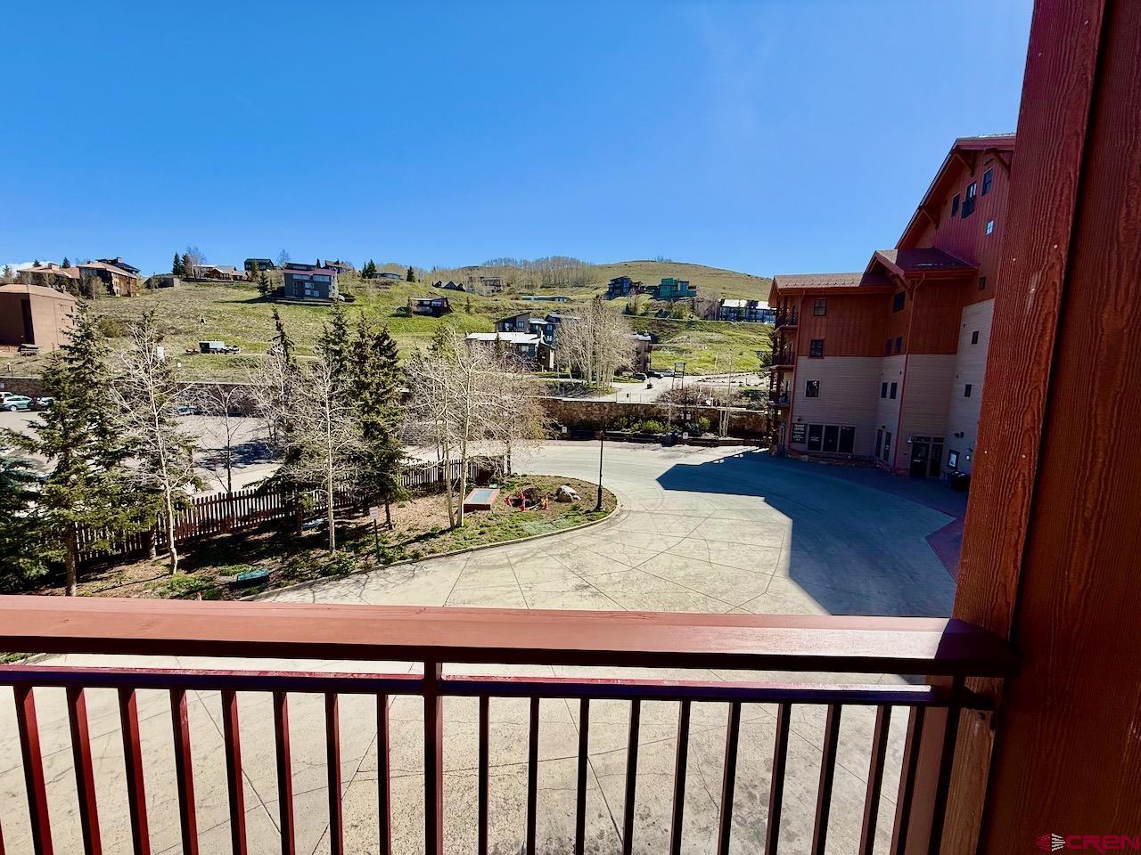620 Gothic Road, Unit 206 Crested Butte, CO 81225 - Photo 30 of 41 a view of balcony with two chairs and a potted plant