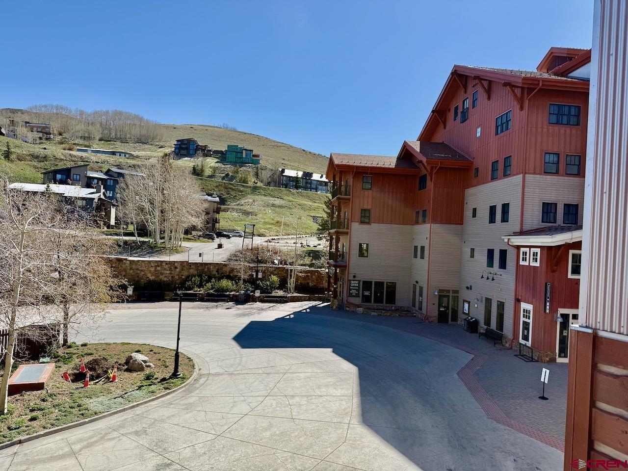 620 Gothic Road, Unit 206 Crested Butte, CO 81225 - Photo 31 of 41 a building with trees in front of it