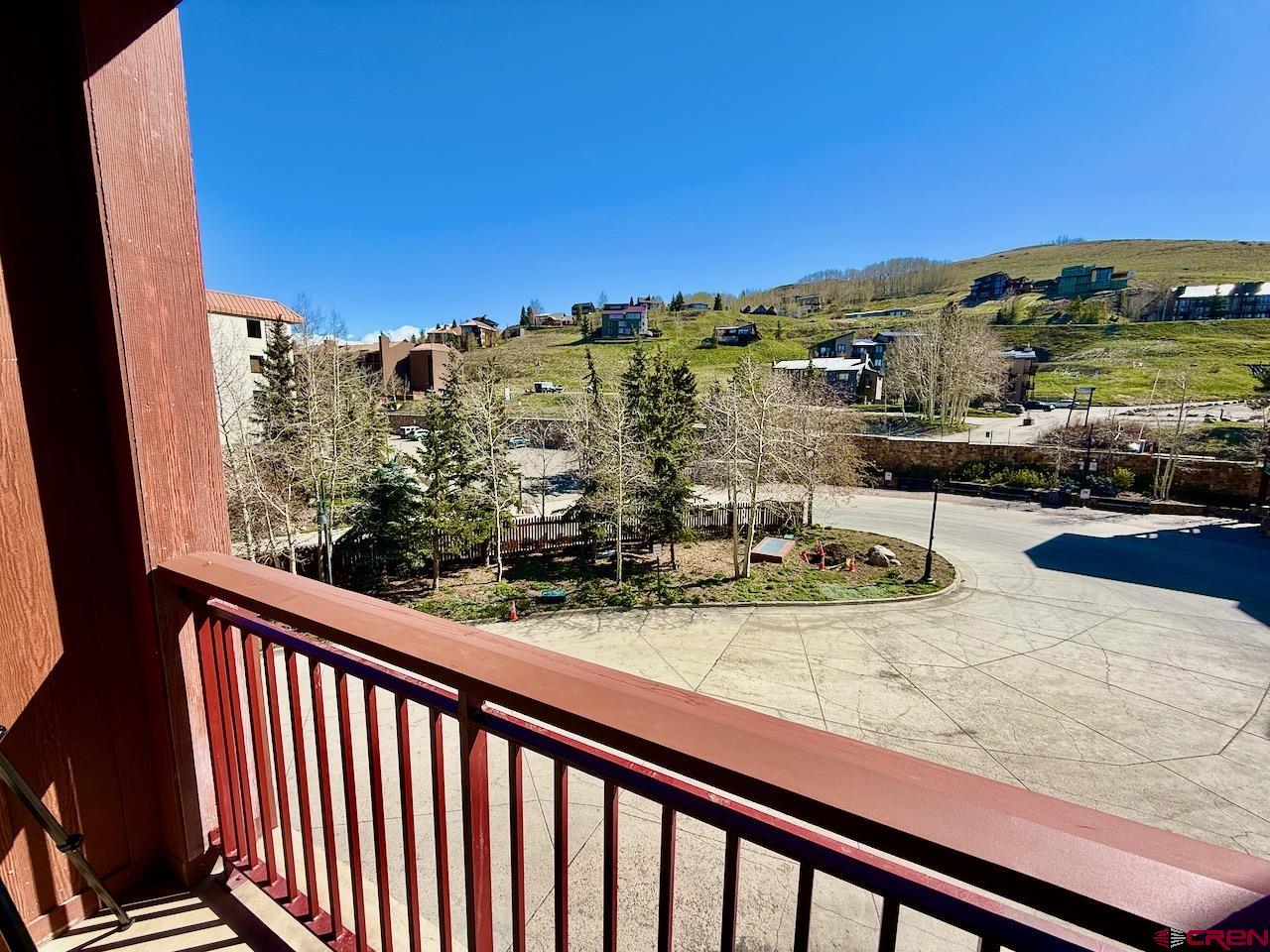 620 Gothic Road, Unit 206 Crested Butte, CO 81225 - Photo 32 of 41 a view of a balcony with an ocean view