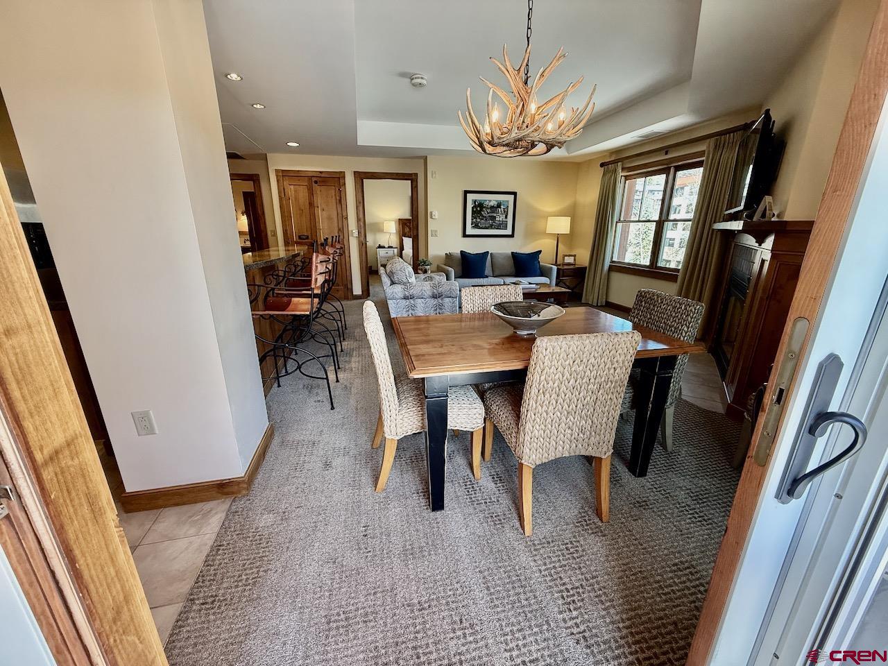 620 Gothic Road, Unit 206 Crested Butte, CO 81225 - Photo 5 of 41 a view of a dining room with furniture and a potted plant