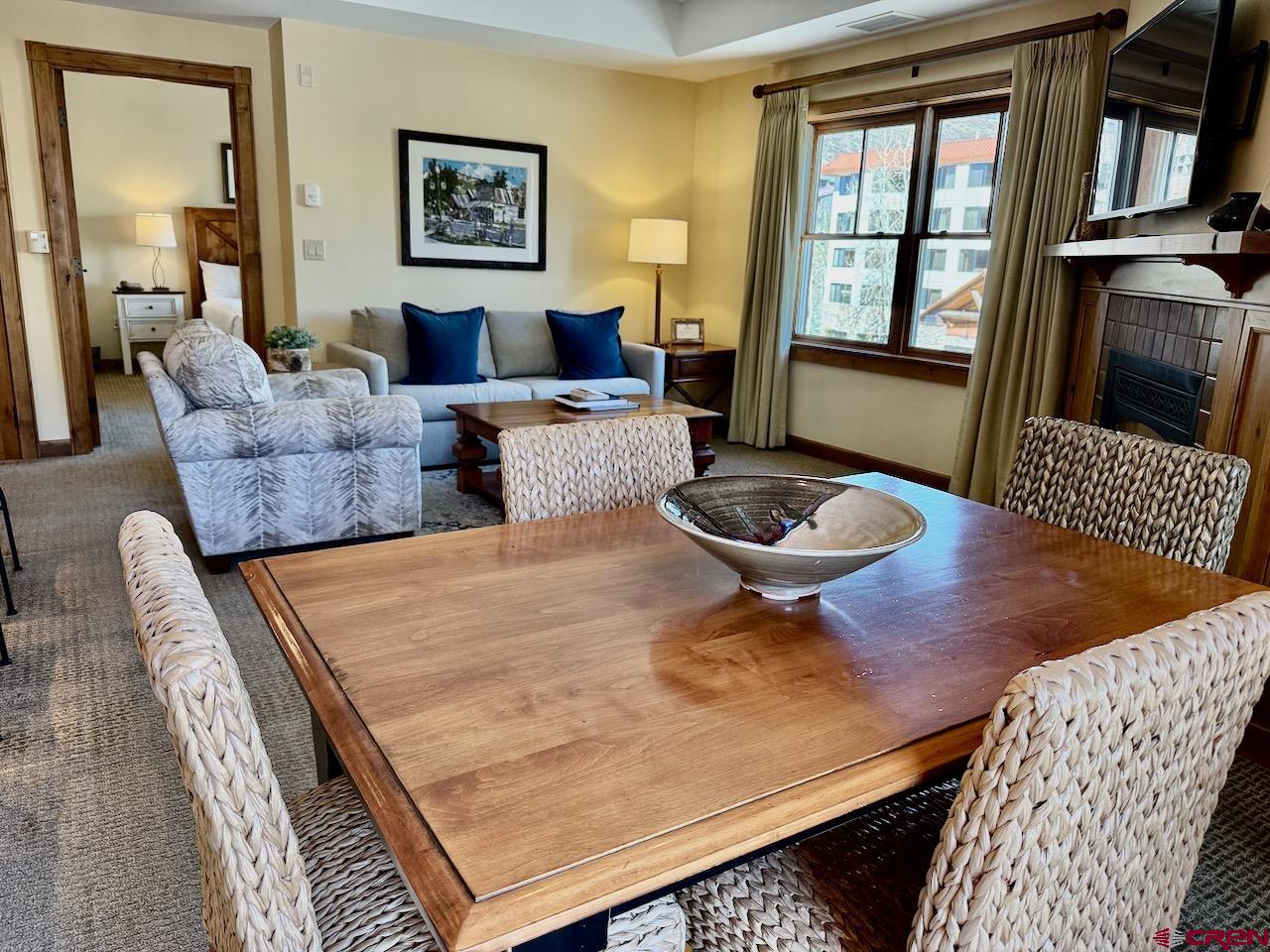 620 Gothic Road, Unit 206 Crested Butte, CO 81225 - Photo 6 of 41 a living room with furniture a window and a table