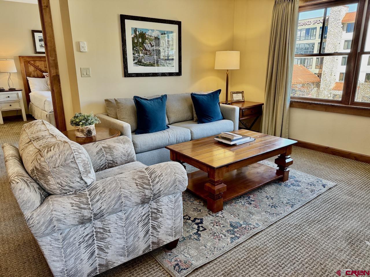 620 Gothic Road, Unit 206 Crested Butte, CO 81225 - Photo 7 of 41 a living room with furniture and a window
