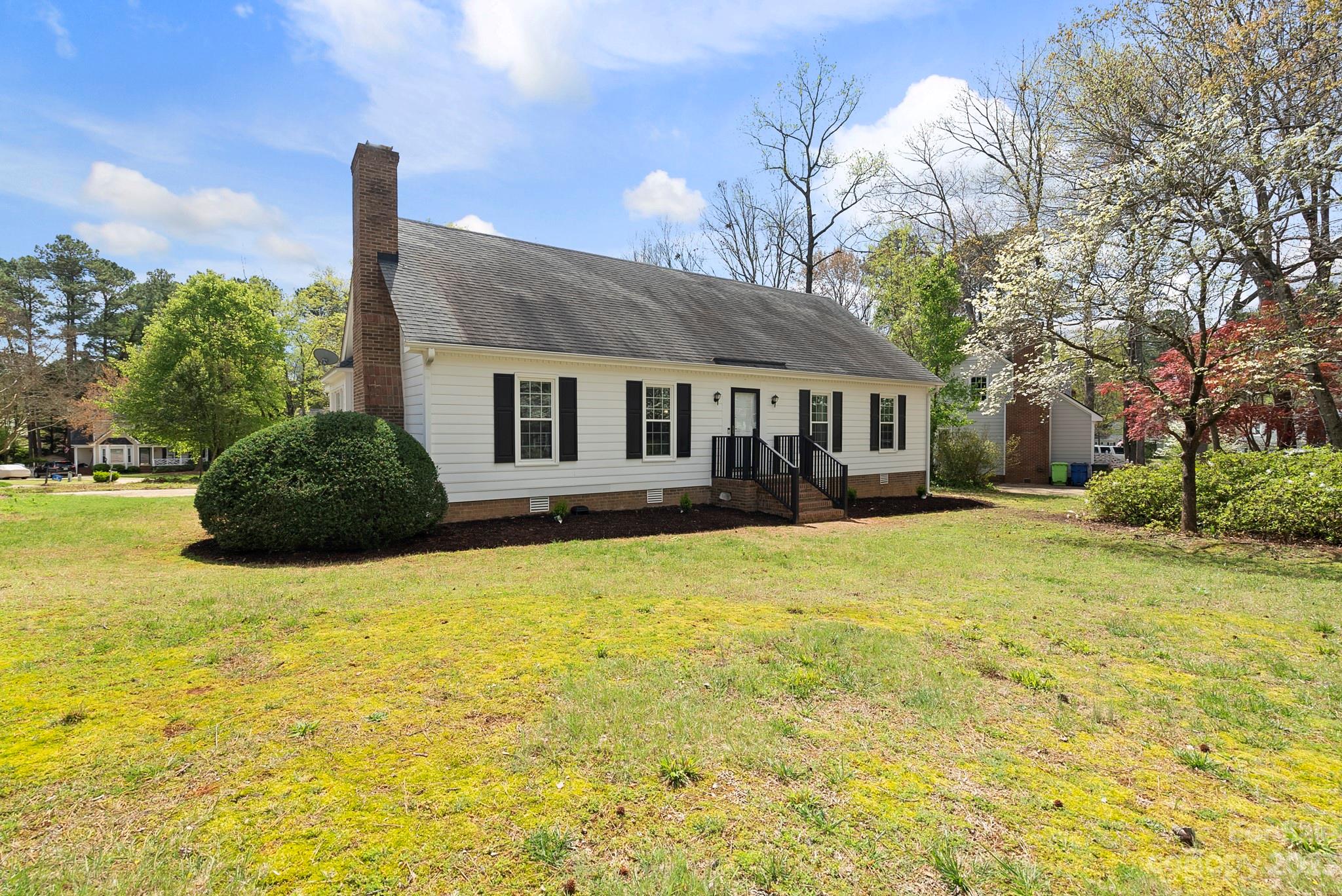 6501 Wynbrook Way Raleigh, NC 27612 - Photo 2 of 30 a house view with swimming pool in front of it