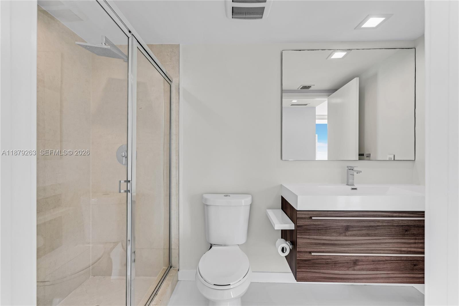 50 Biscayne Boulevard, Unit 3601 Miami, FL 33132 - Photo 12 of 83 a bathroom with a toilet a sink and shower
