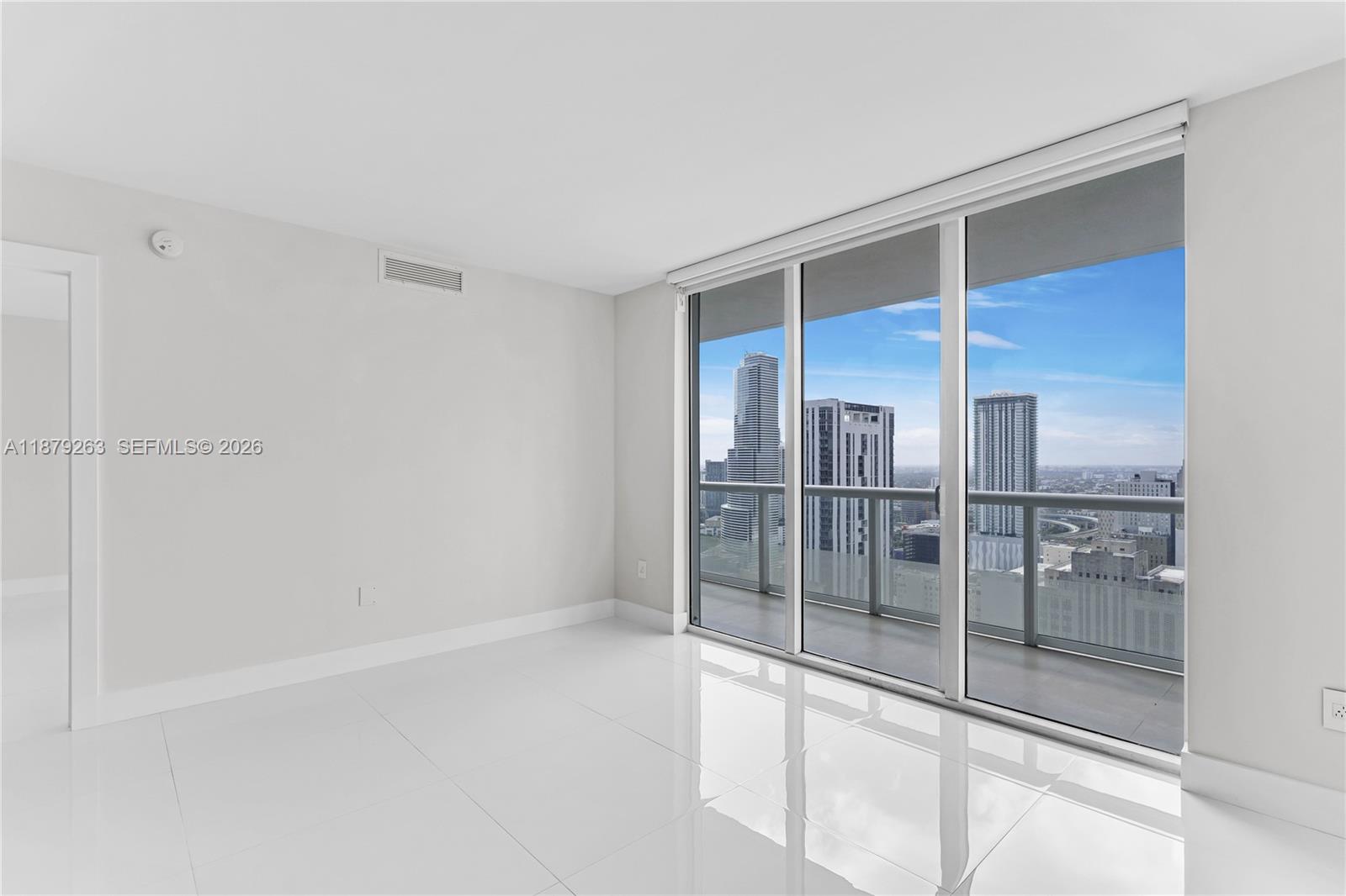 50 Biscayne Boulevard, Unit 3601 Miami, FL 33132 - Photo 21 of 83 a spacious bathroom with a glass shower door and sink