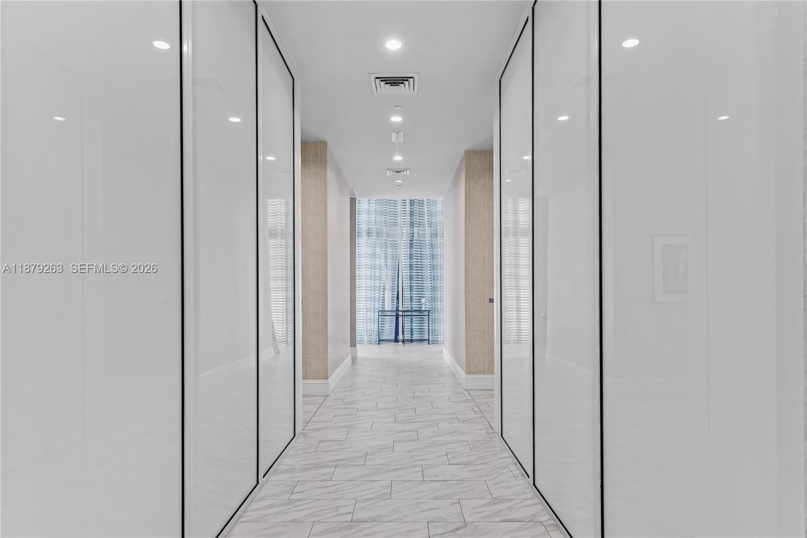 50 Biscayne Boulevard, Unit 3601 Miami, FL 33132 - Photo 71 of 83 a view of a hallway with wooden shelves
