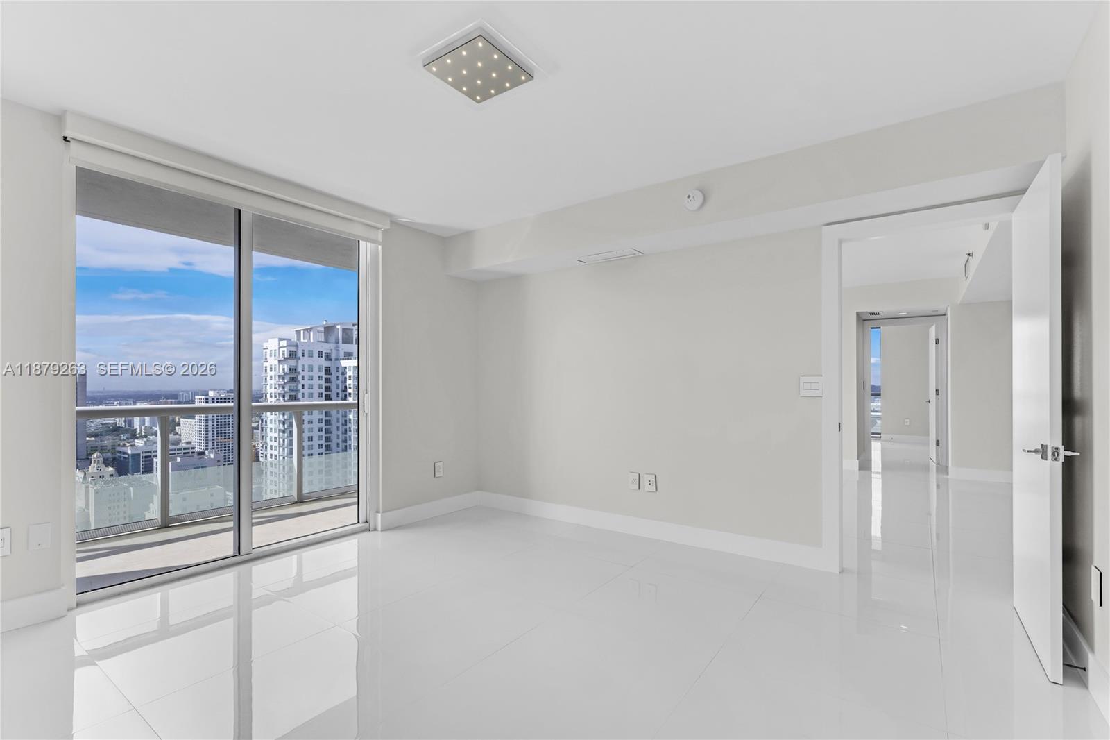 50 Biscayne Boulevard, Unit 3601 Miami, FL 33132 - Photo 8 of 83 a view of an empty room with a window