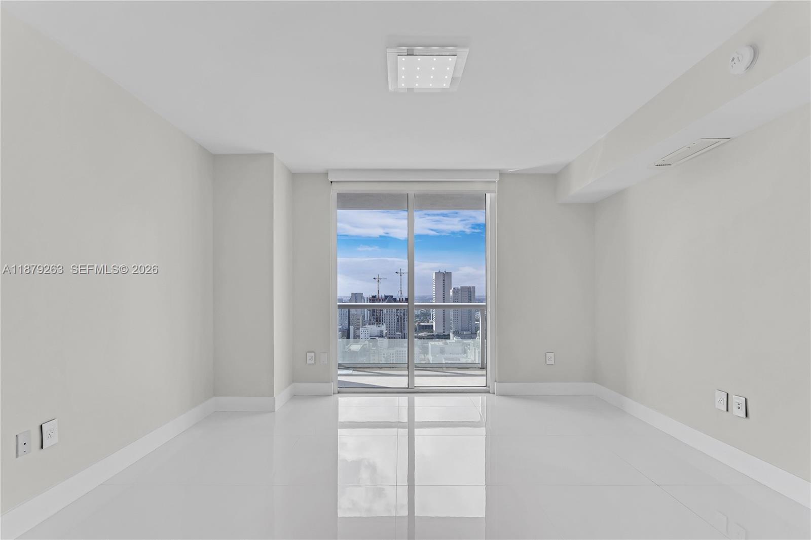 50 Biscayne Boulevard, Unit 3601 Miami, FL 33132 - Photo 10 of 83 a view of an empty room with a window