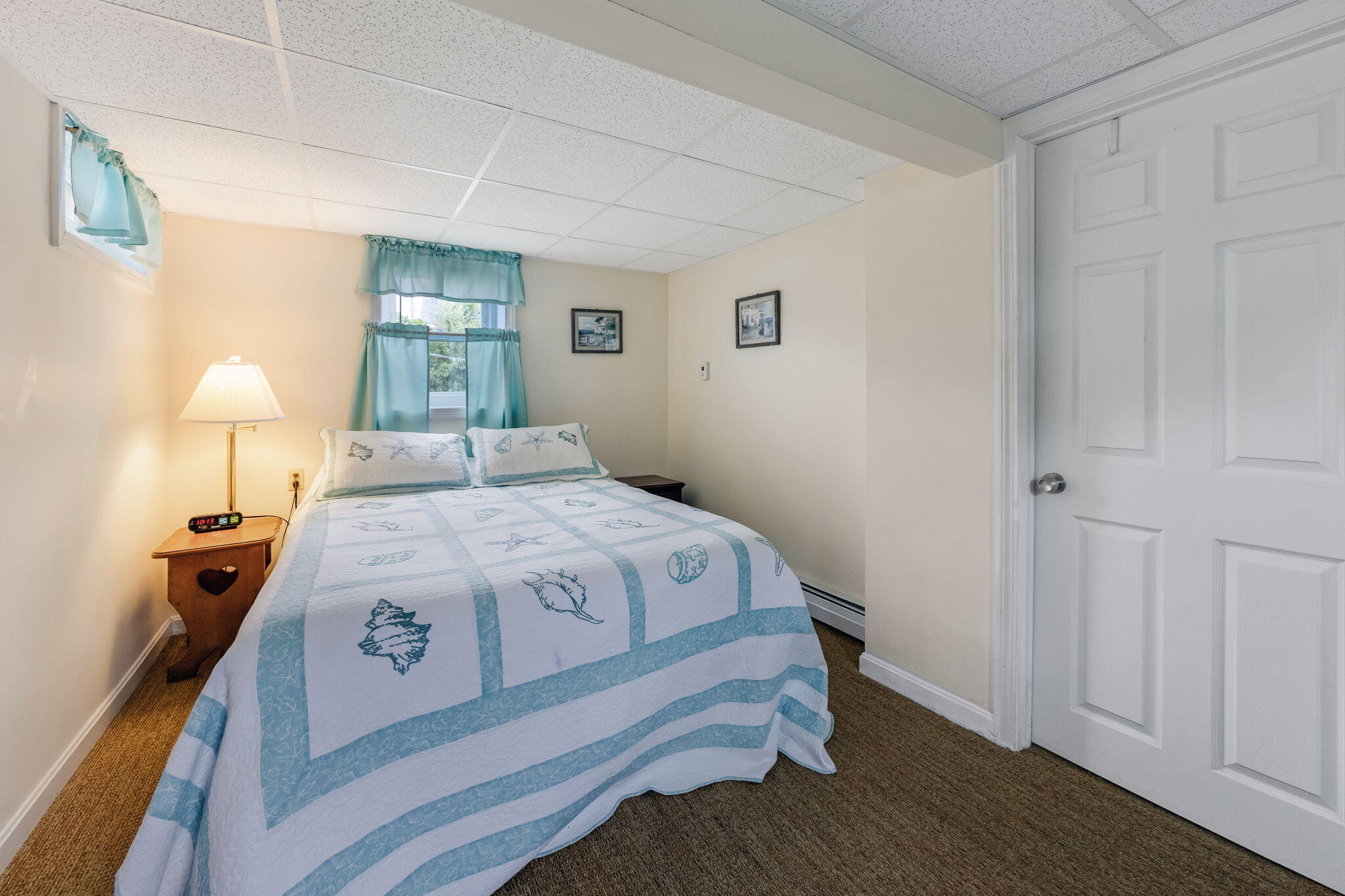 357 Phillips Road Sandwich, MA 02563 - Photo 13 of 28 a bedroom with a bed and a lamp on dresser