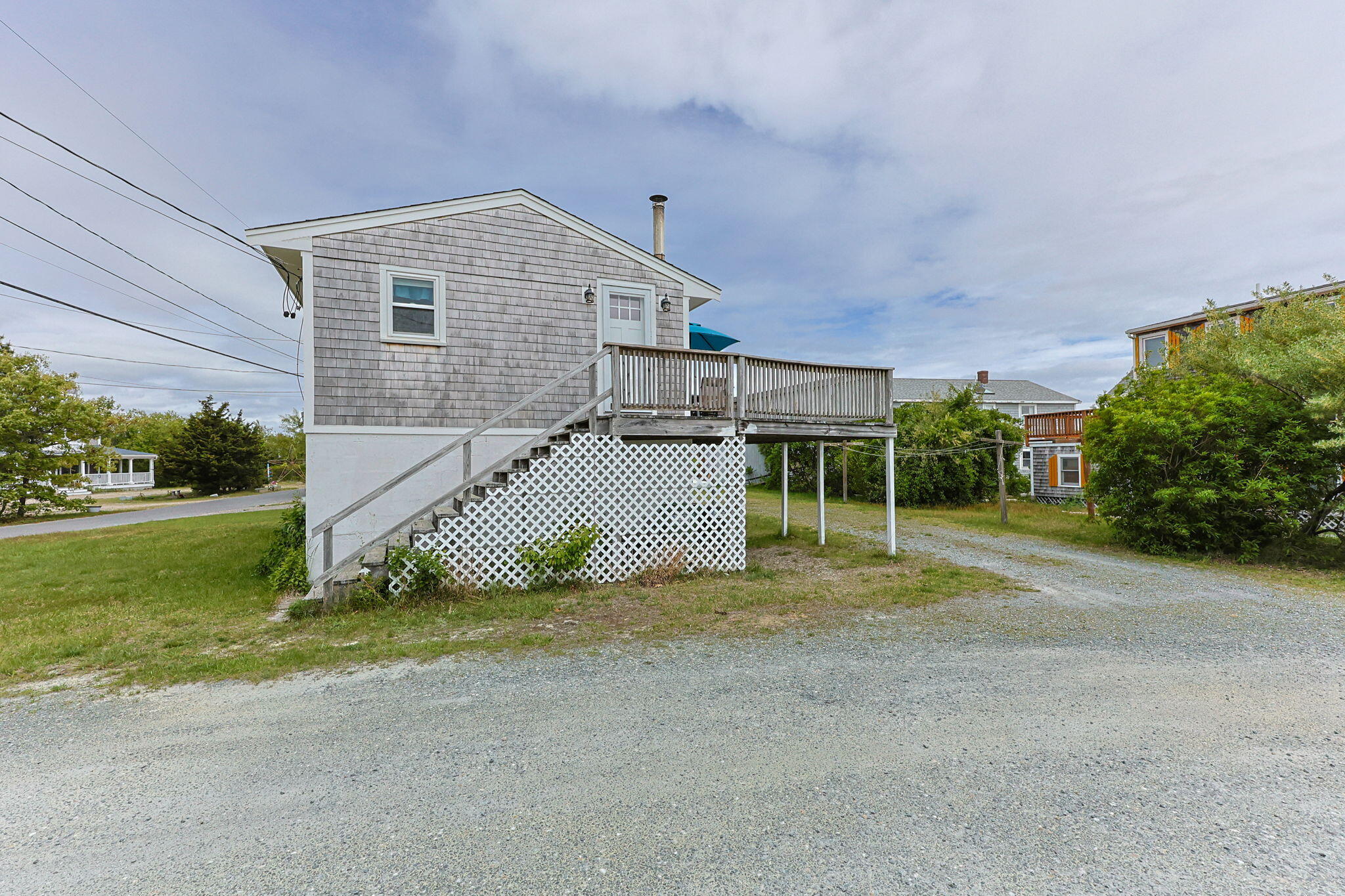 357 Phillips Road Sandwich, MA 02563 - Photo 19 of 28 a view of a house with a yard and garage