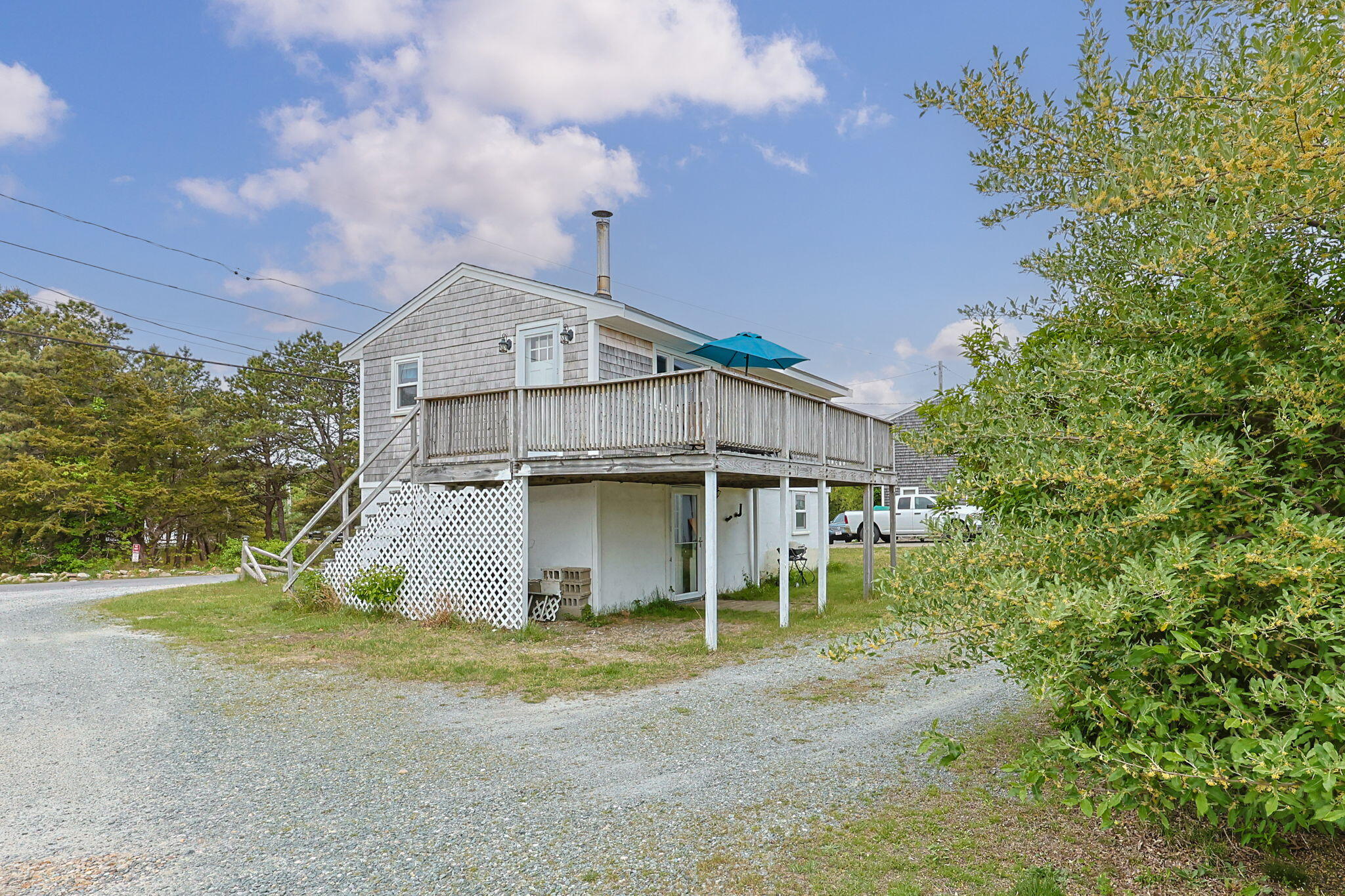 357 Phillips Road Sandwich, MA 02563 - Photo 20 of 28 a view of a house with a yard and large tree