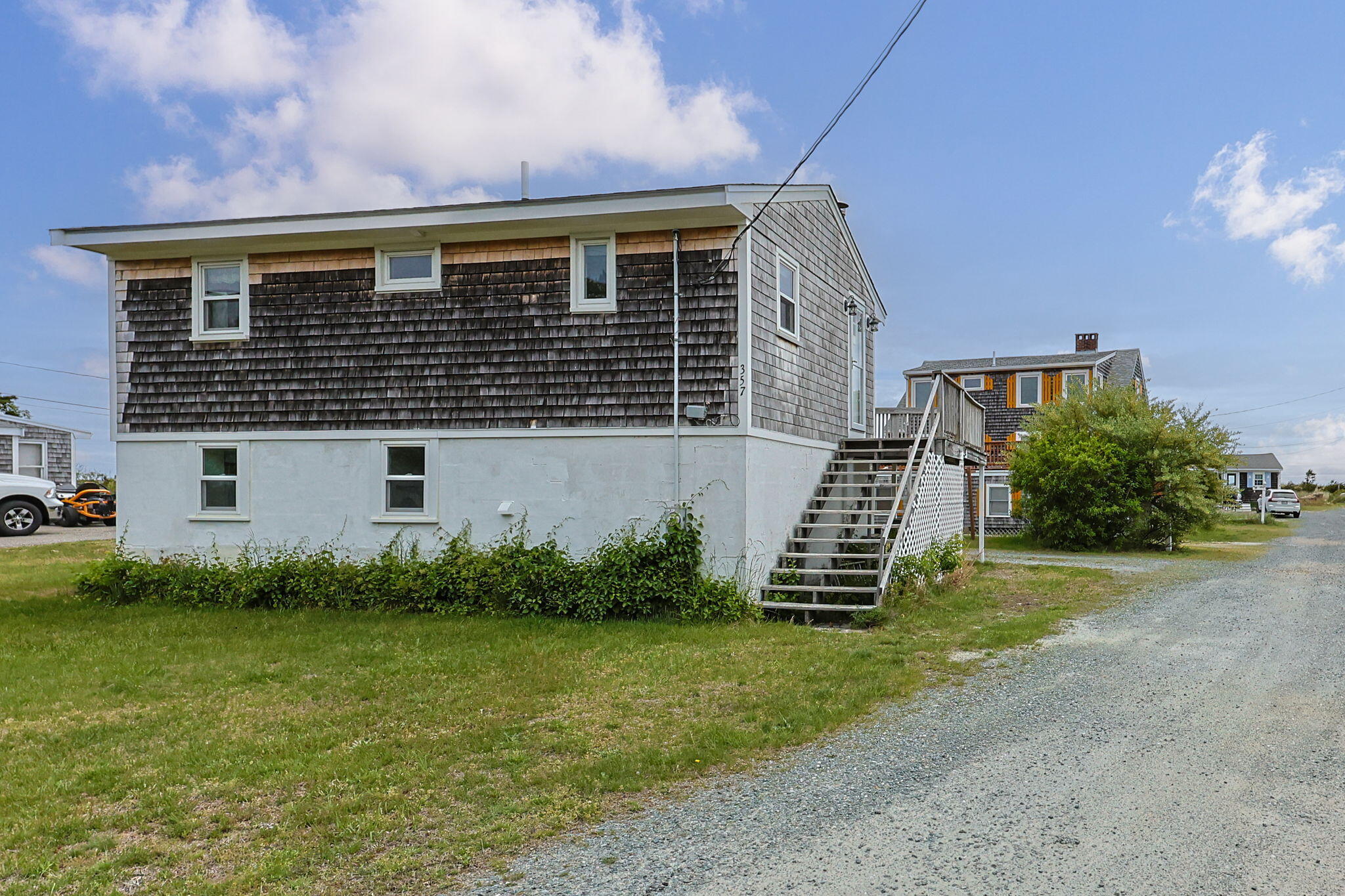 357 Phillips Road Sandwich, MA 02563 - Photo 2 of 28 a front view of a house with a garden
