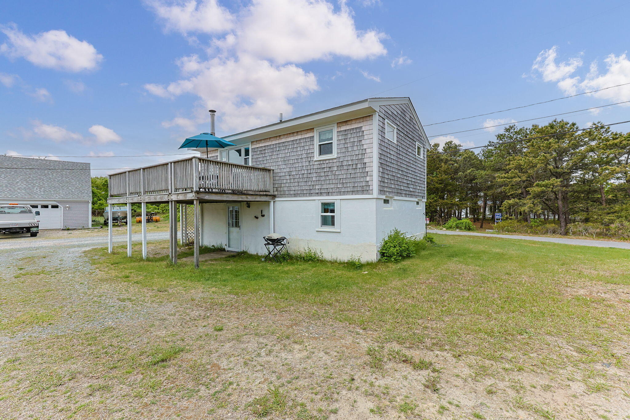 357 Phillips Road Sandwich, MA 02563 - Photo 21 of 28 a view of a house with a yard