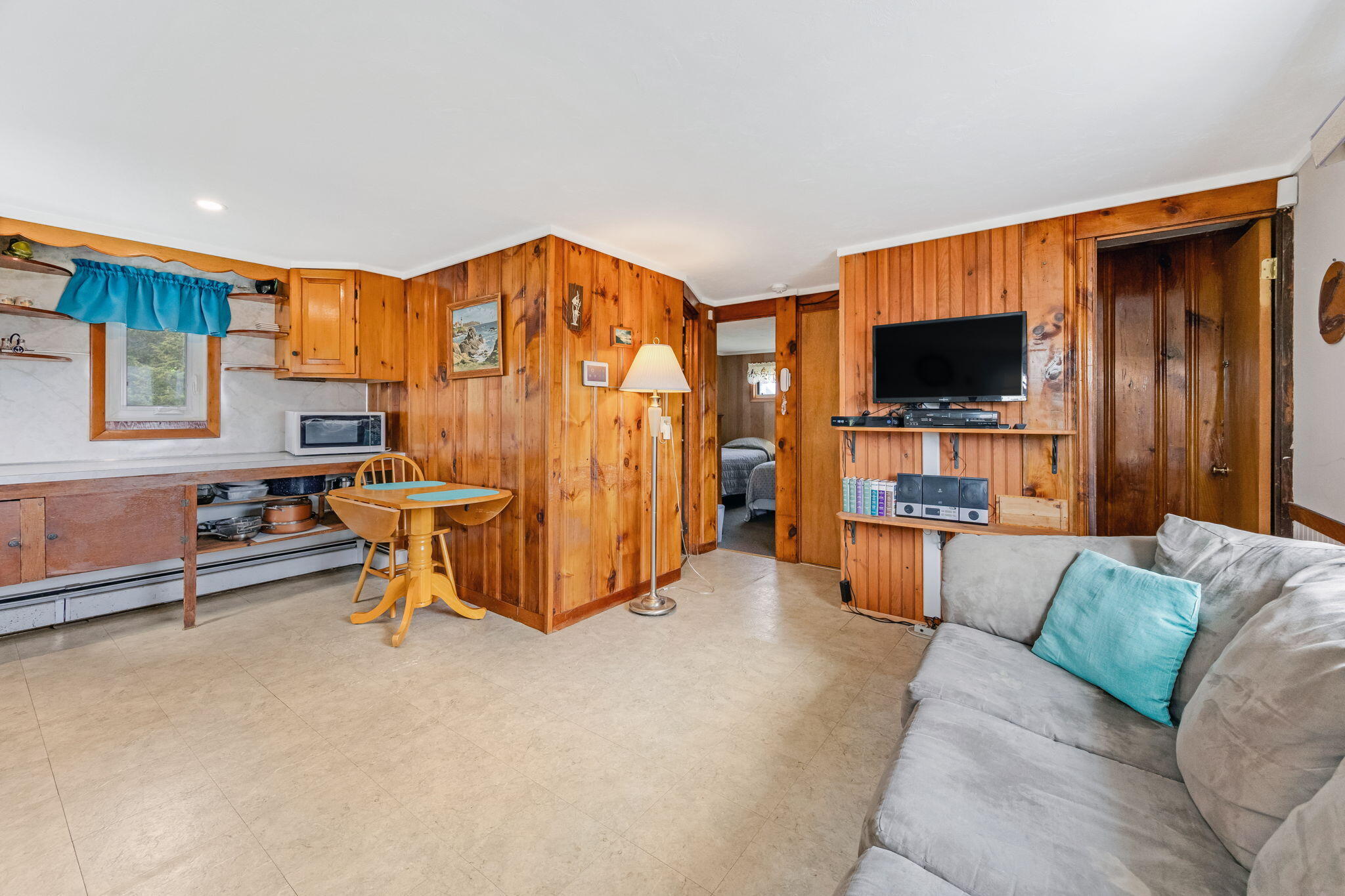 357 Phillips Road Sandwich, MA 02563 - Photo 10 of 28 a living room with furniture and a flat screen tv