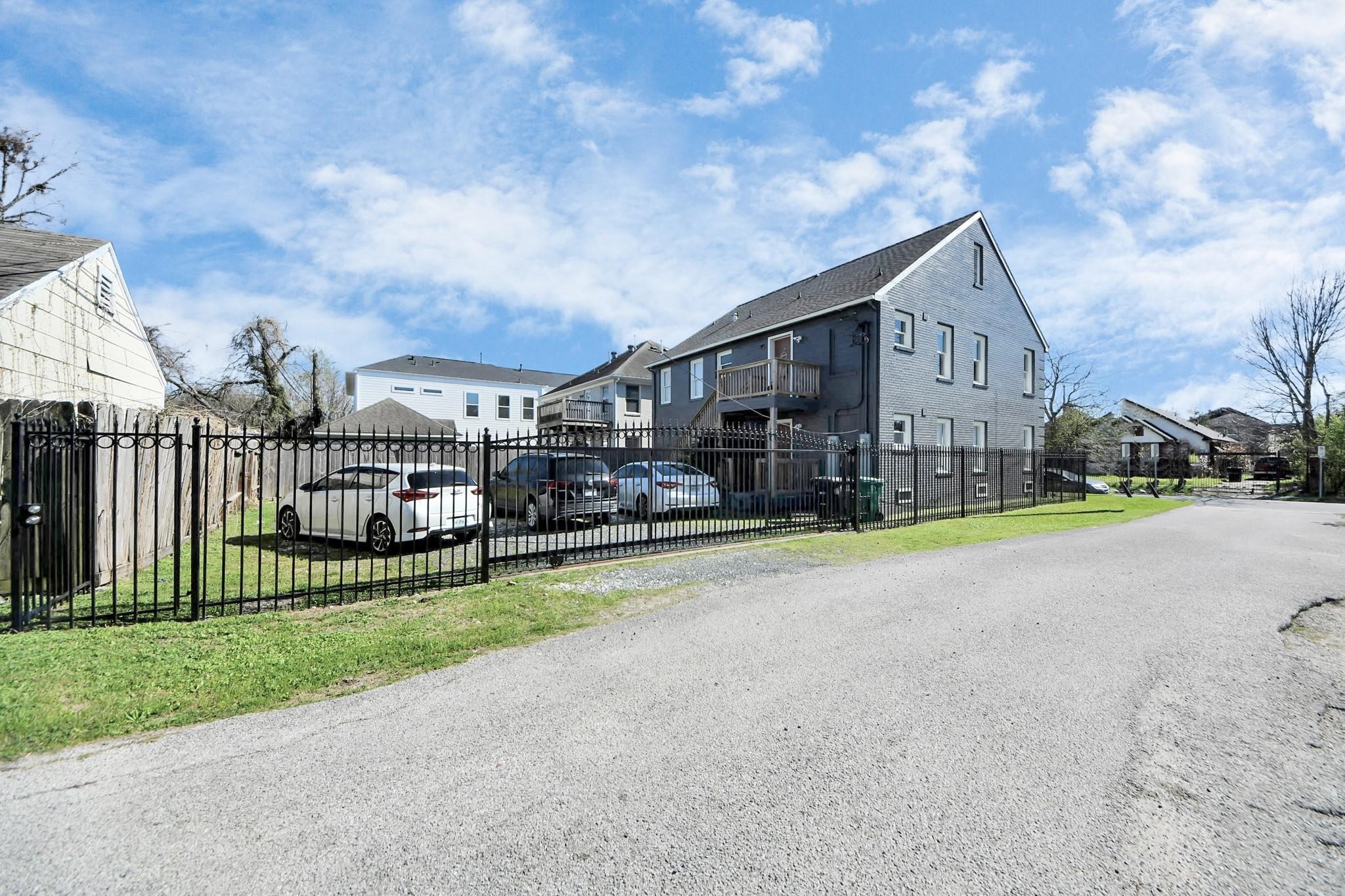 2903 Wichita Street, Unit 1 Houston, TX 77004 - Photo 19 of 19 a view of a house with a big yard and large trees