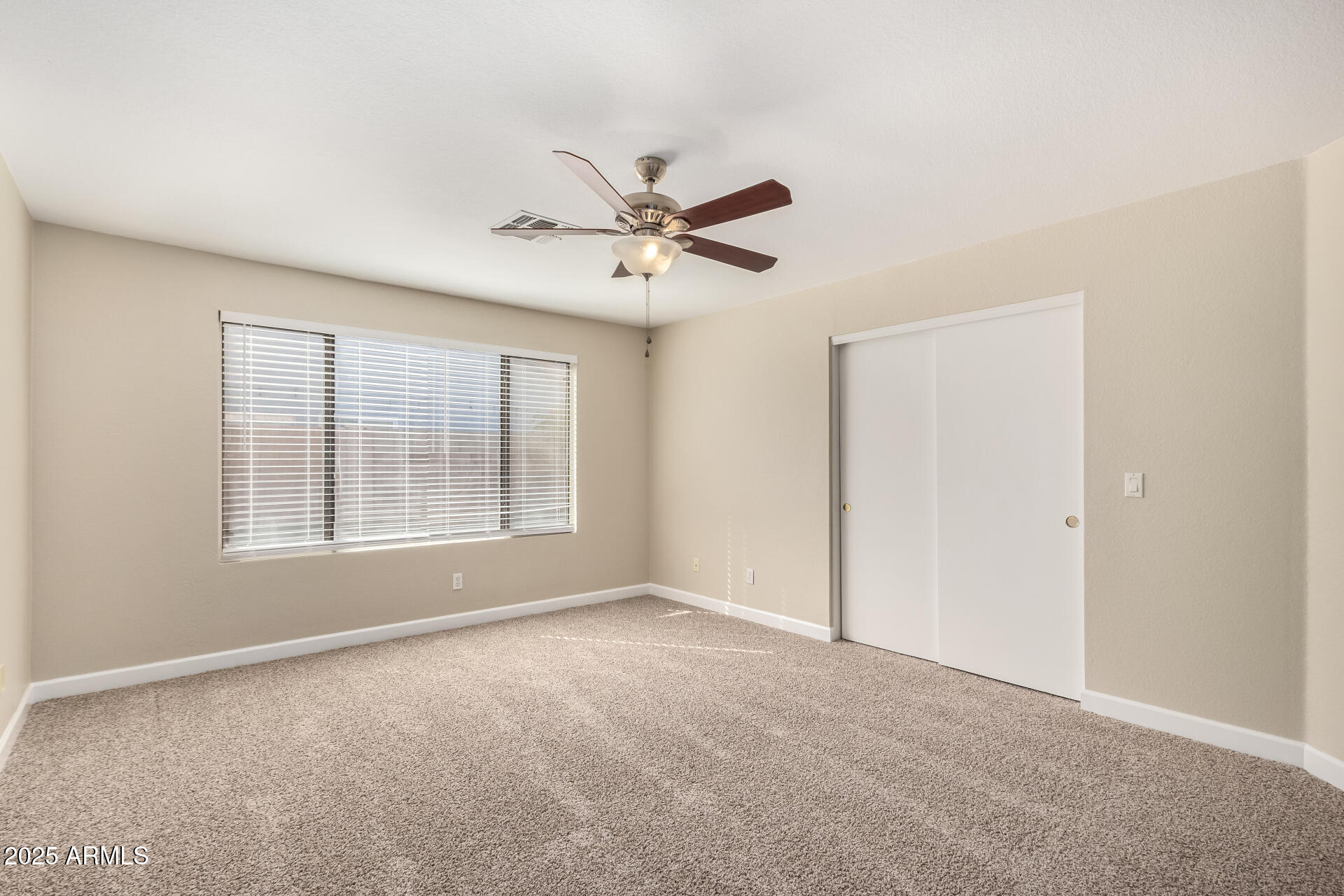 501 West Mesquite Street Gilbert, AZ 85233 - Photo 13 of 24 a view of a livingroom with a ceiling fan and window