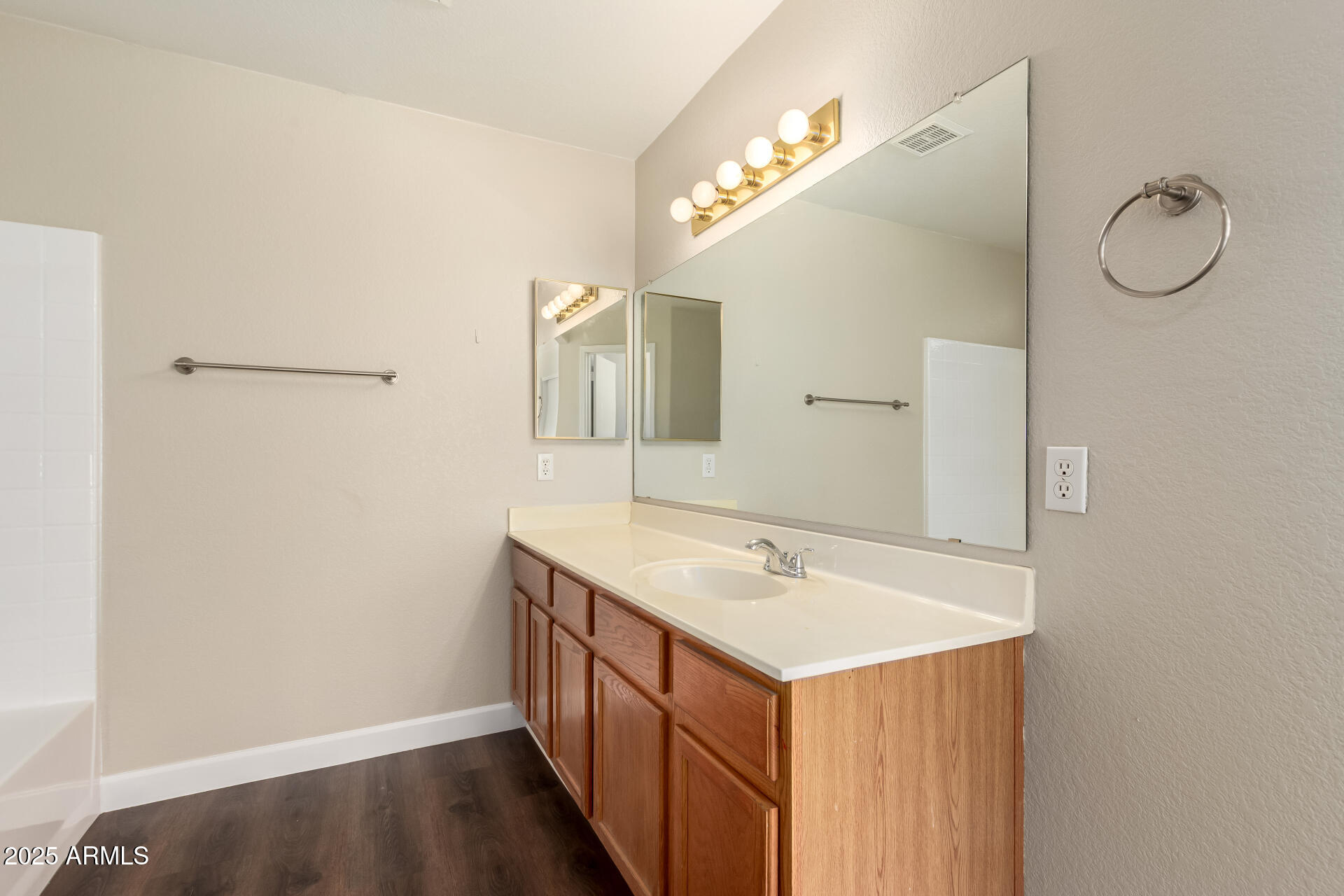 501 West Mesquite Street Gilbert, AZ 85233 - Photo 16 of 24 a bathroom with a sink vanity and mirror
