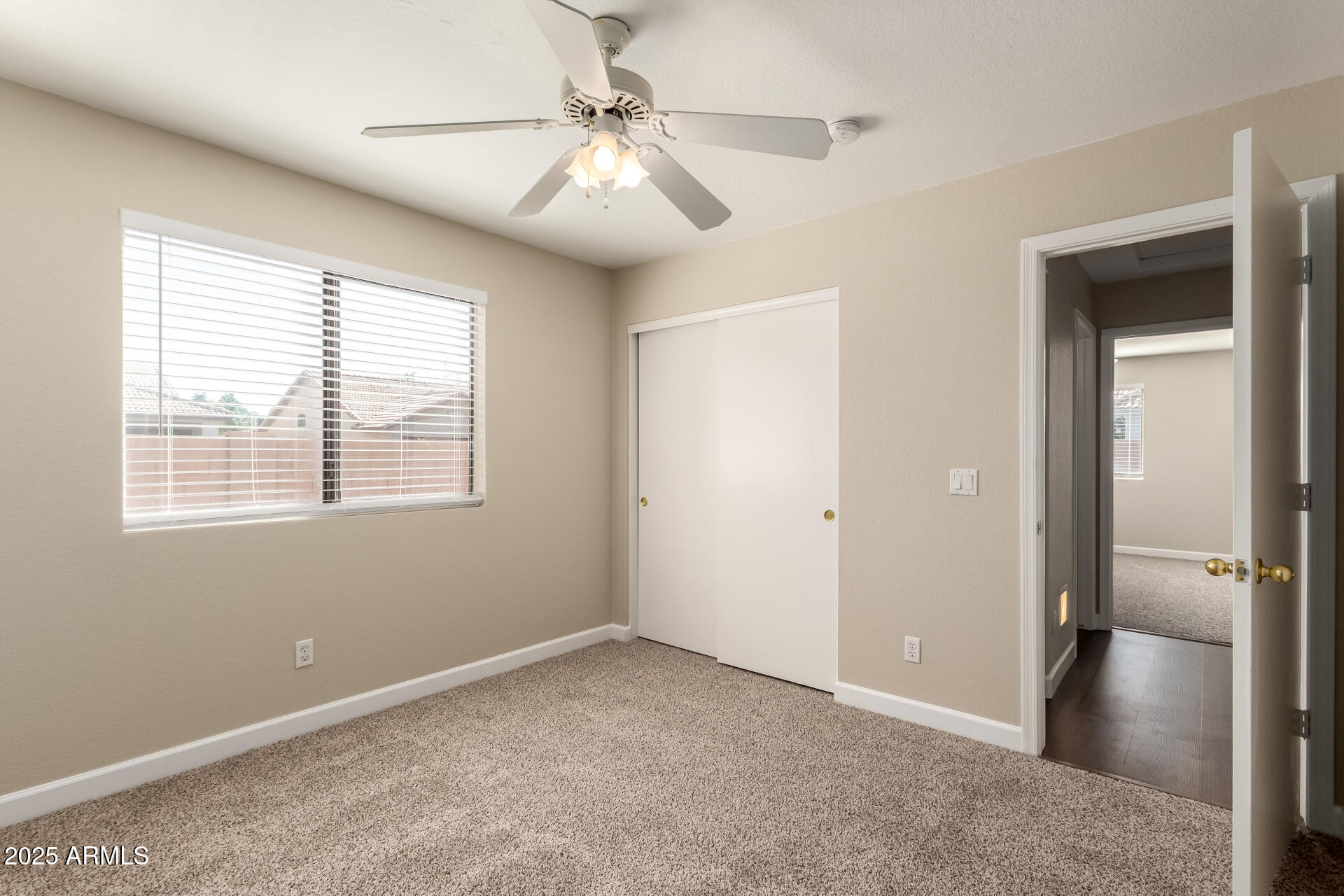 501 West Mesquite Street Gilbert, AZ 85233 - Photo 22 of 24 a view of a livingroom with a ceiling fan and window
