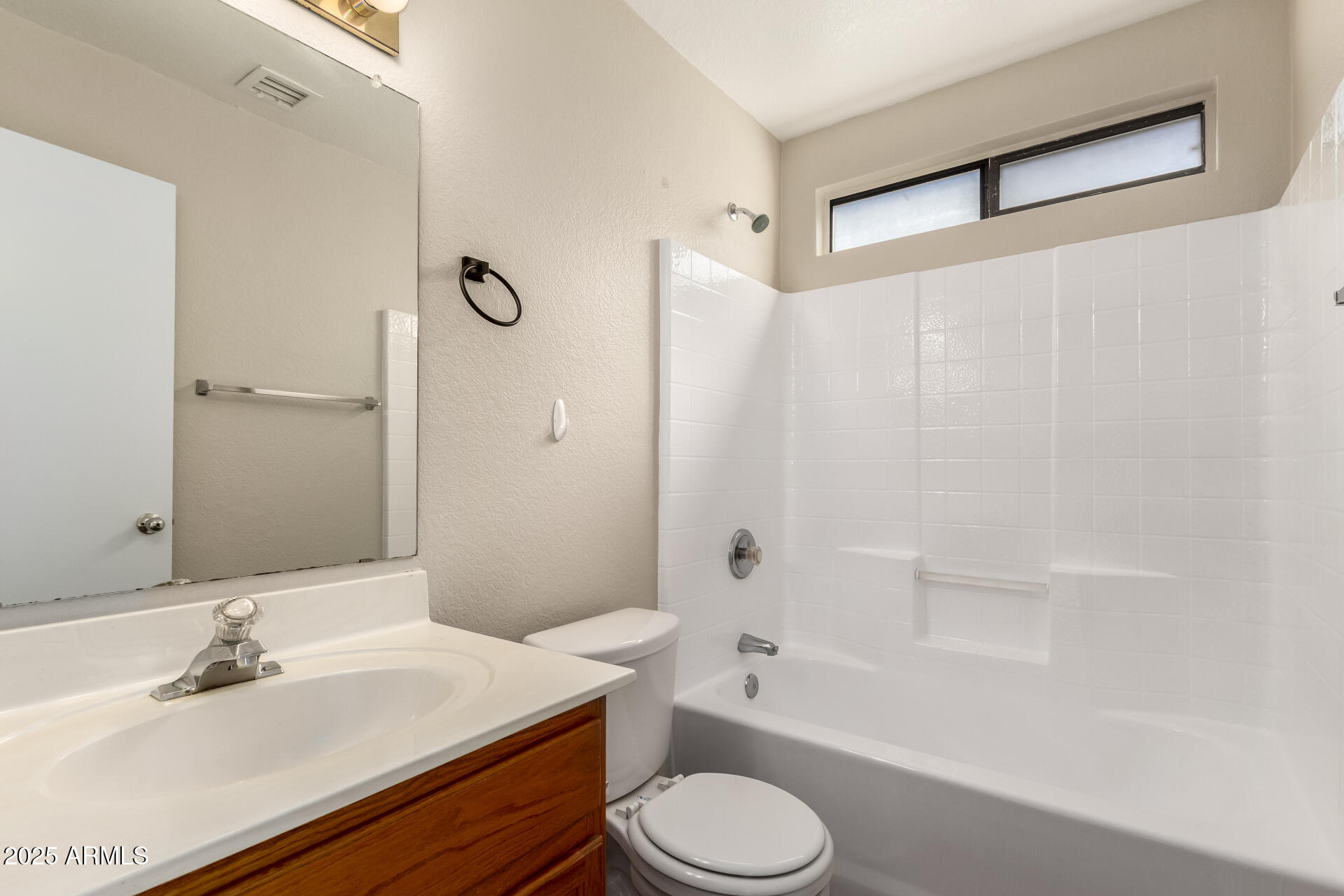501 West Mesquite Street Gilbert, AZ 85233 - Photo 23 of 24 a bathroom with a sink a toilet and shower