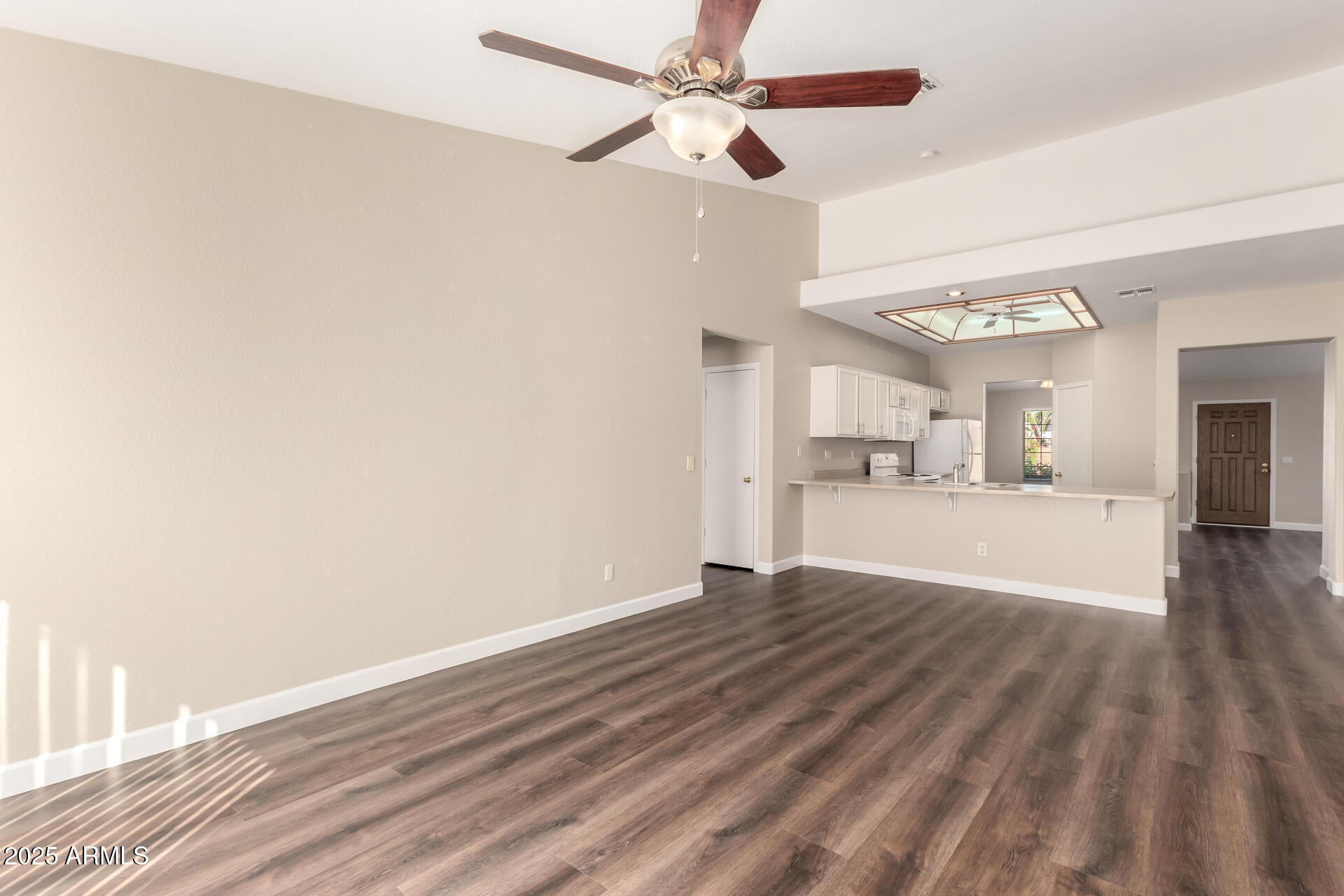 501 West Mesquite Street Gilbert, AZ 85233 - Photo 8 of 24 a view of a kitchen with wooden floor and a kitchen space with a sink
