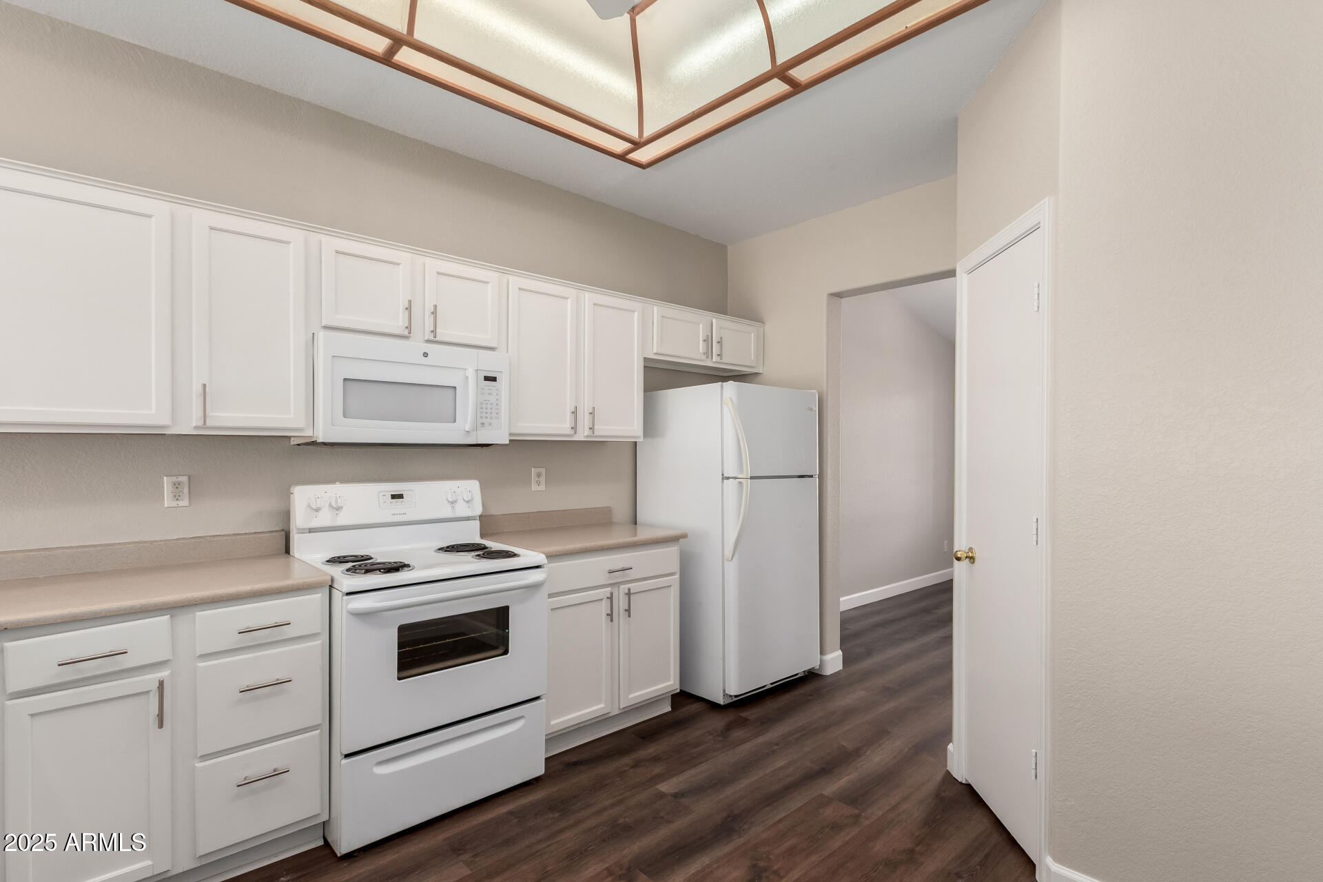501 West Mesquite Street Gilbert, AZ 85233 - Photo 10 of 24 a kitchen with cabinets appliances wooden floor and view living room