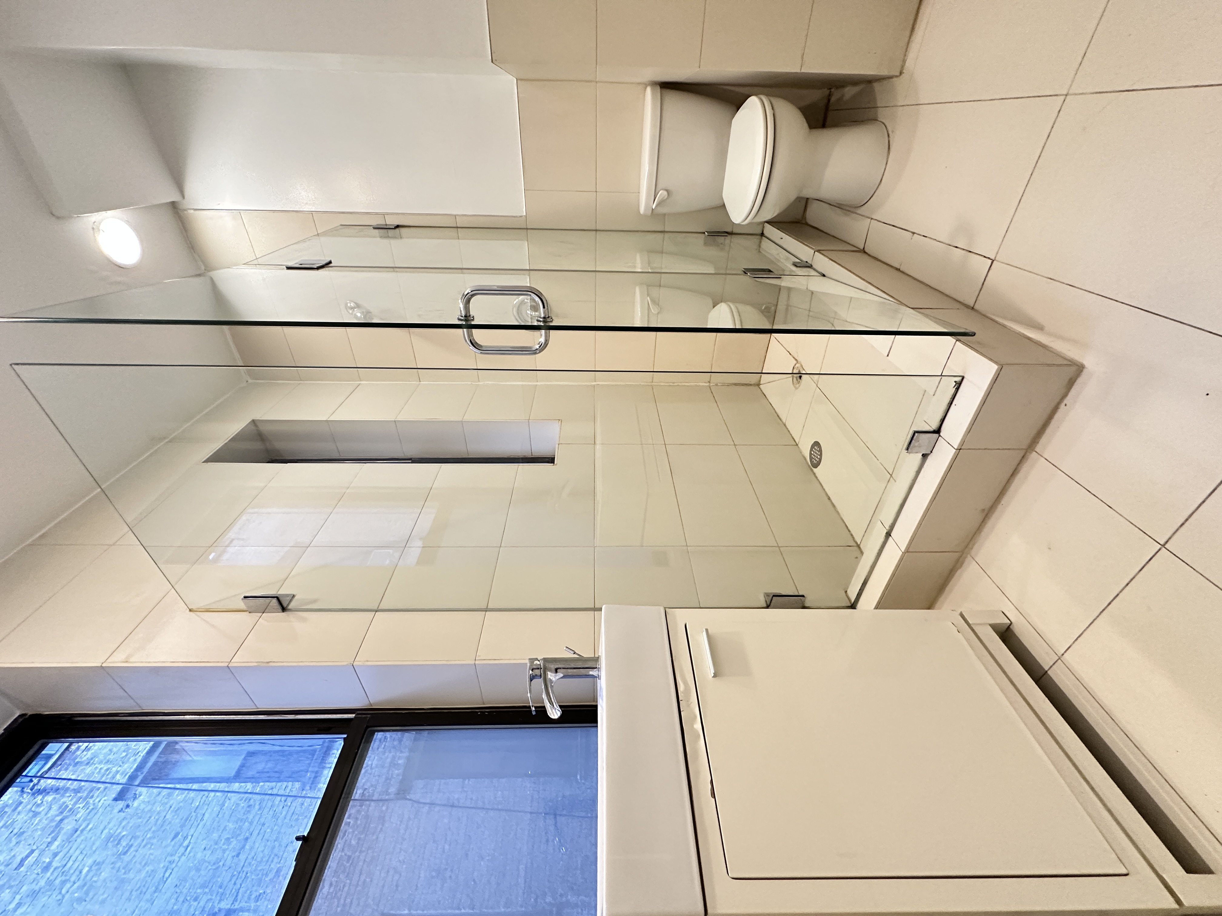 601 West 149th Street, Unit 35 Manhattan, NY 10031 - Photo 8 of 9 a bathroom with a shower and a sink