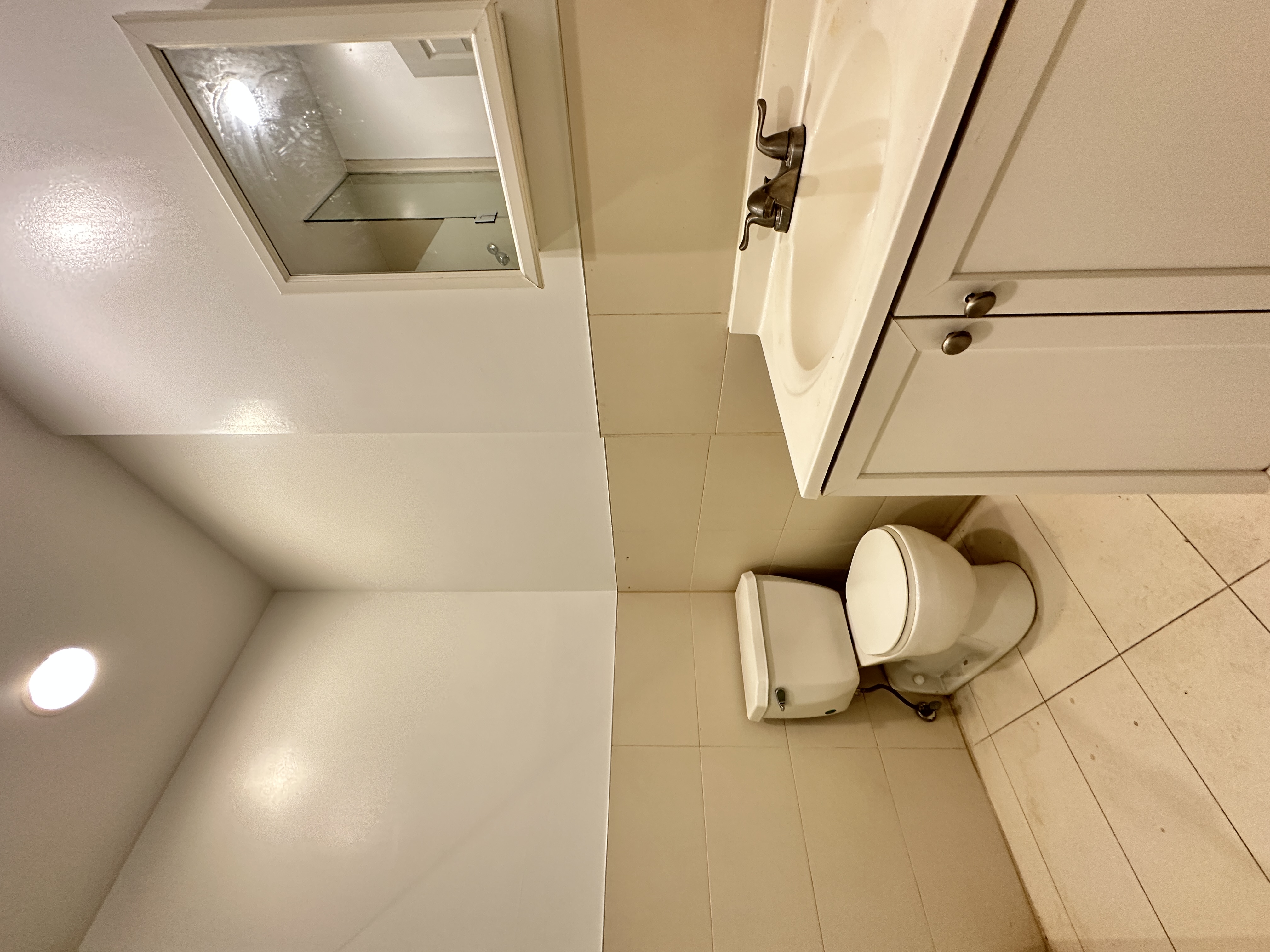 601 West 149th Street, Unit 35 Manhattan, NY 10031 - Photo 9 of 9 a bathroom with a sink a toilet and mirror