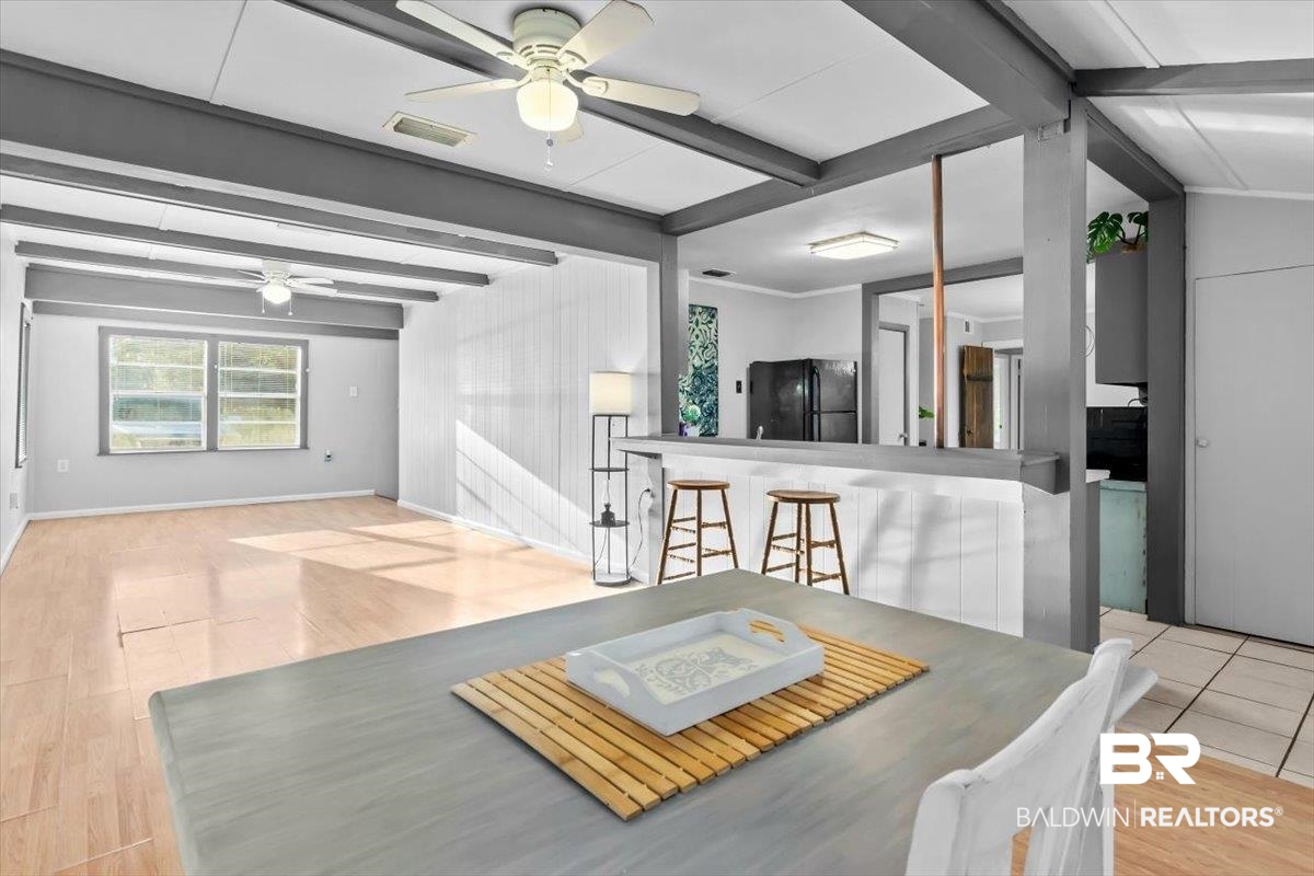 4918 Quimby Drive Mobile, AL 36619 - Photo 4 of 38 Dining space with ceiling fan, beam ceiling, and wood finished floors