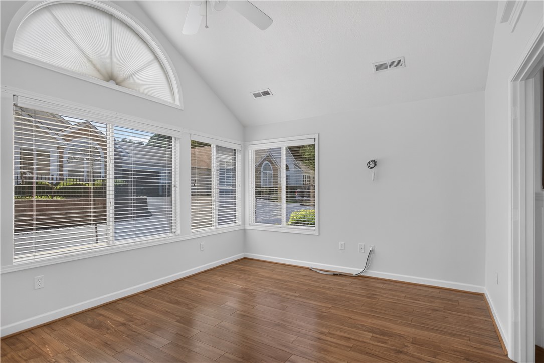 134 Life Style Lane Anderson, SC 29621 - Photo 11 of 44 A well-lit sunroom boasts high vaulted ceilings and polished hardwood flooring.