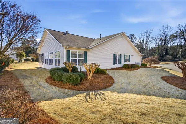 a front view of a house with a yard