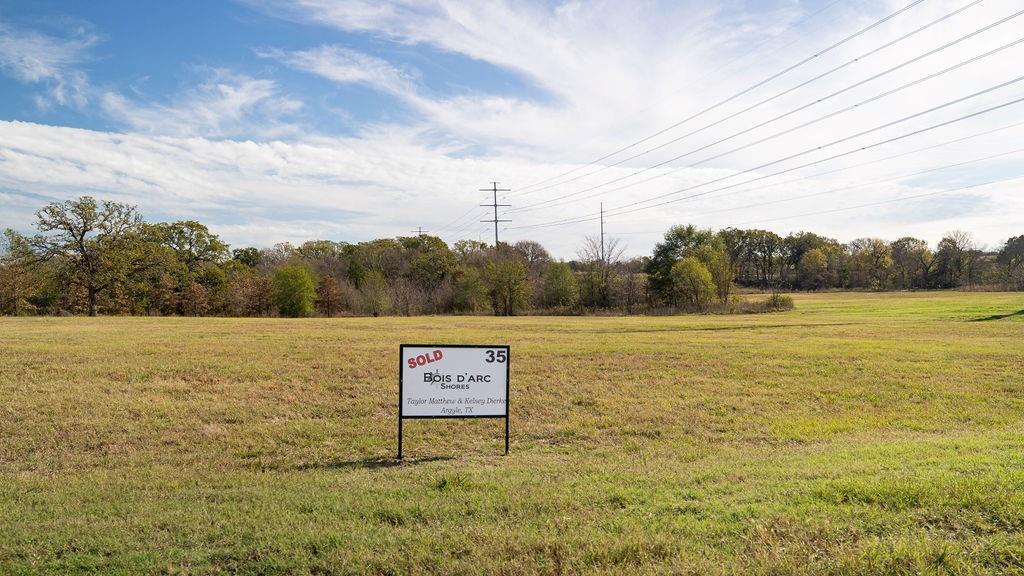 580 Waters Edge Way Dodd City, TX 75438 - Photo 15 of 17 a sign board with lake view