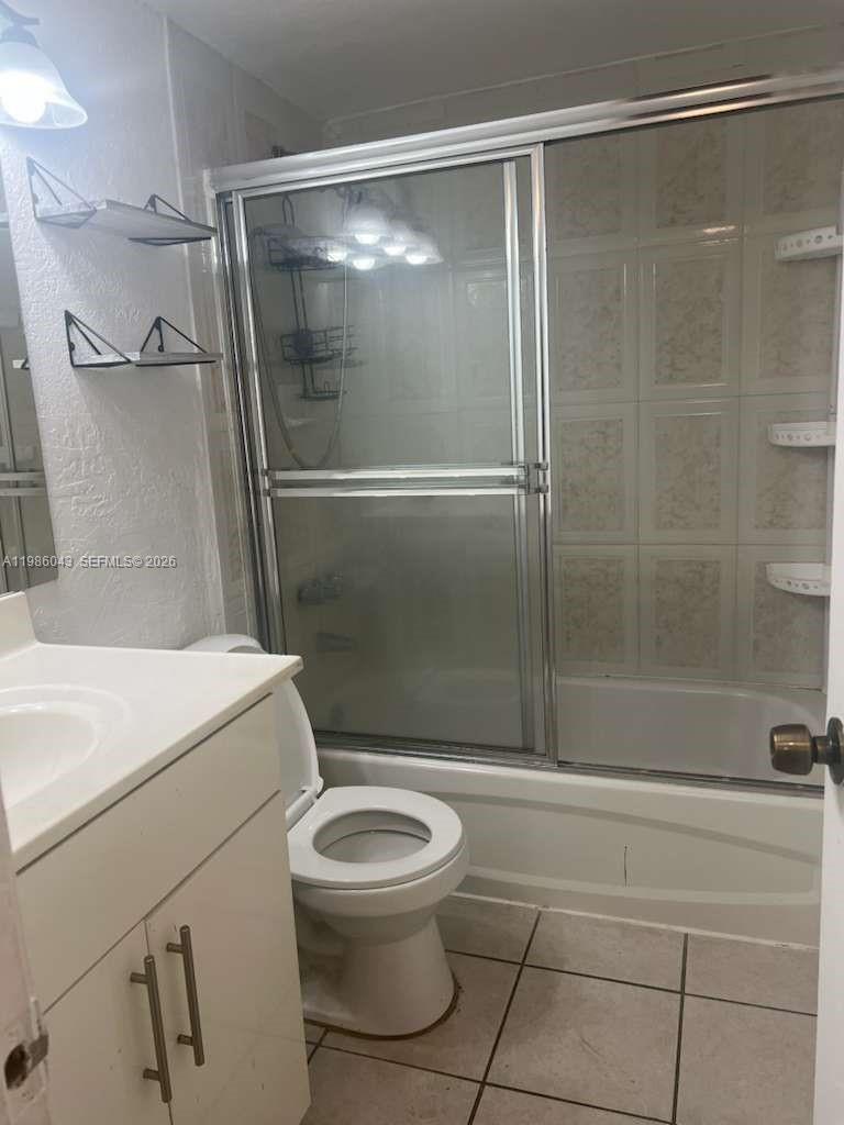 4550 Northwest 9th Street, Unit 114E Miami, FL 33126 - Photo 3 of 9 a bathroom with a toilet and a shower