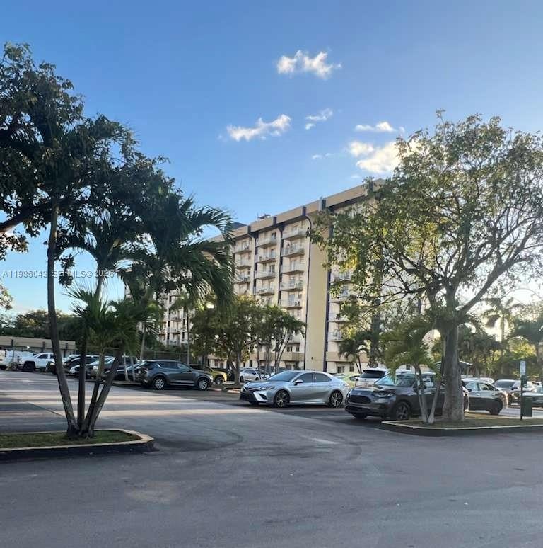 4550 Northwest 9th Street, Unit 114E Miami, FL 33126 - Photo 7 of 9 a view of street with cars