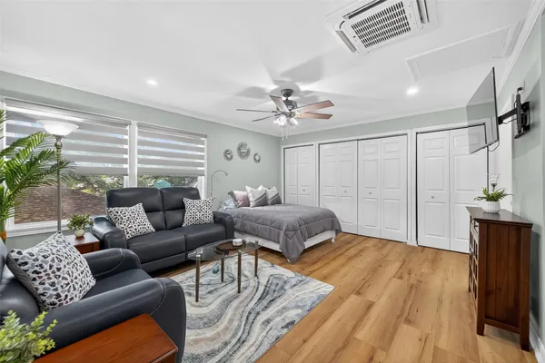 a living room with furniture and a chandelier