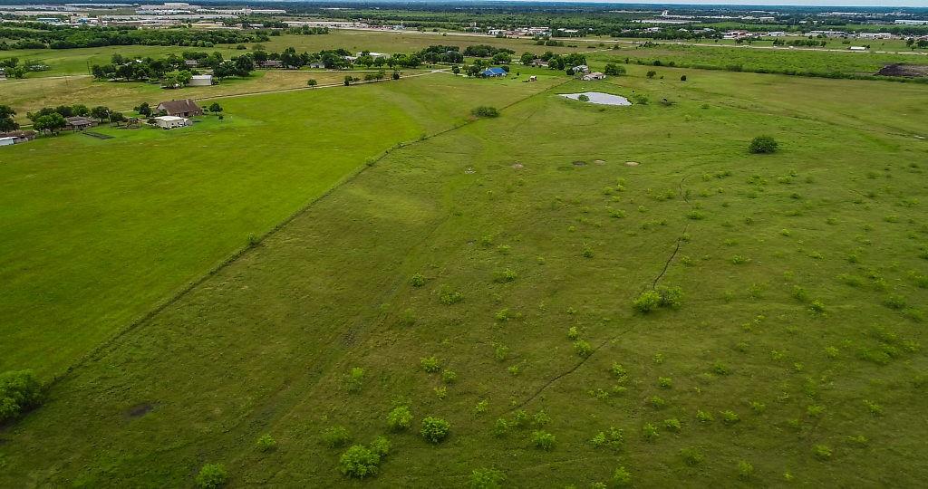 225 Valek Road Ennis, TX 75119 - Photo 6 of 8 a view of a big yard with green space