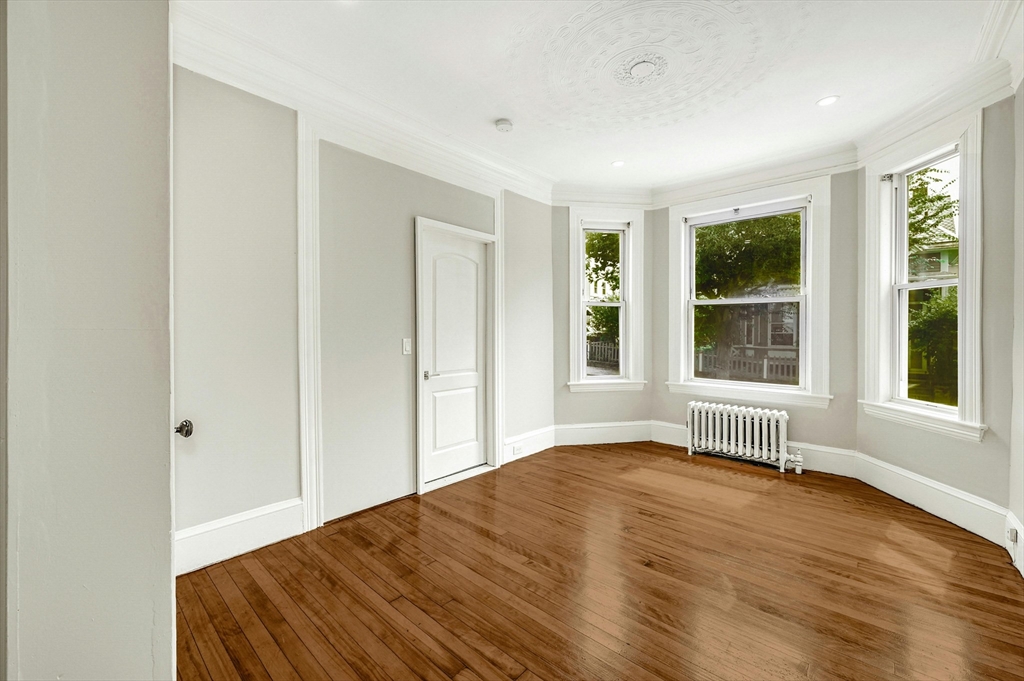 34 William Street Worcester, MA 01609 - Photo 12 of 41 a view of empty room with wooden floor and fan