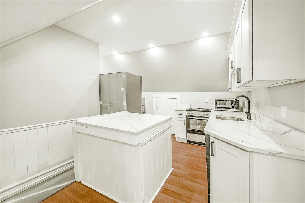 34 William Street Worcester, MA 01609 - Photo 15 of 41 a utility room with sink dryer and washer
