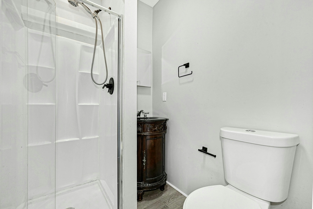 34 William Street Worcester, MA 01609 - Photo 21 of 41 a bathroom with a toilet and a shower