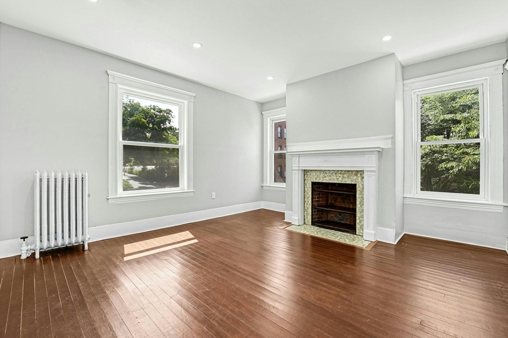 34 William Street Worcester, MA 01609 - Photo 23 of 41 a view of an empty room with wooden floor and a window