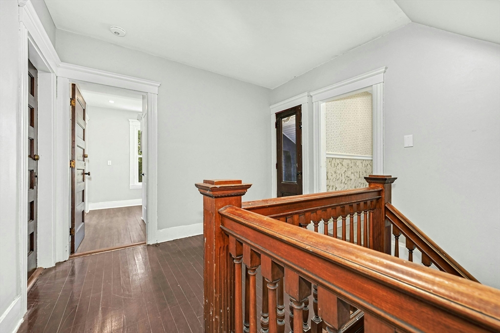 34 William Street Worcester, MA 01609 - Photo 28 of 41 a view of a hallway with wooden floor and staircase