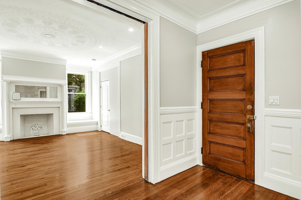 34 William Street Worcester, MA 01609 - Photo 3 of 41 wooden floor in an empty room with a window