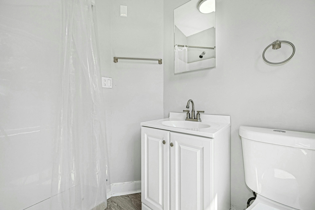 34 William Street Worcester, MA 01609 - Photo 33 of 41 a view of storage and utility room with racks on the wall