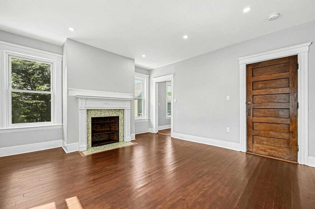 34 William Street Worcester, MA 01609 - Photo 36 of 41 a view of an empty room with a window and fireplace