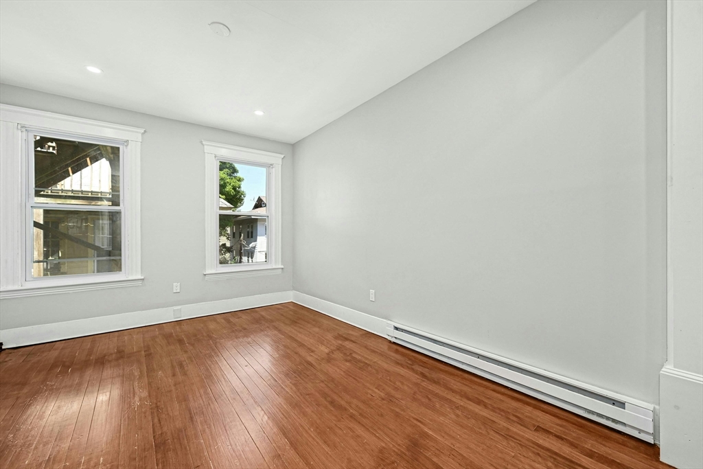 34 William Street Worcester, MA 01609 - Photo 41 of 41 an empty room with wooden floor and windows