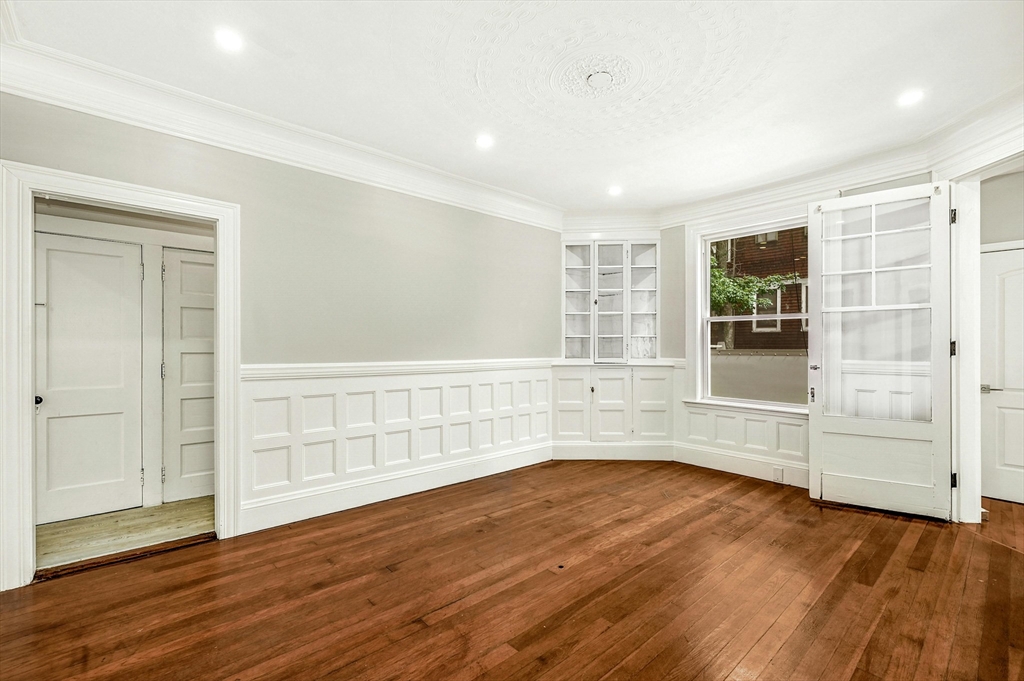 34 William Street Worcester, MA 01609 - Photo 5 of 41 wooden floor in an empty room with a window