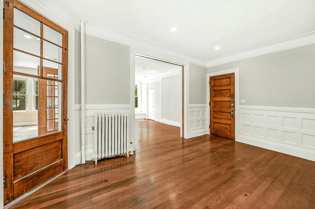 34 William Street Worcester, MA 01609 - Photo 6 of 41 wooden floor in an empty room with a window