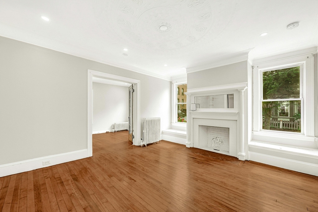 34 William Street Worcester, MA 01609 - Photo 7 of 41 a view of empty room with wooden floor and fan